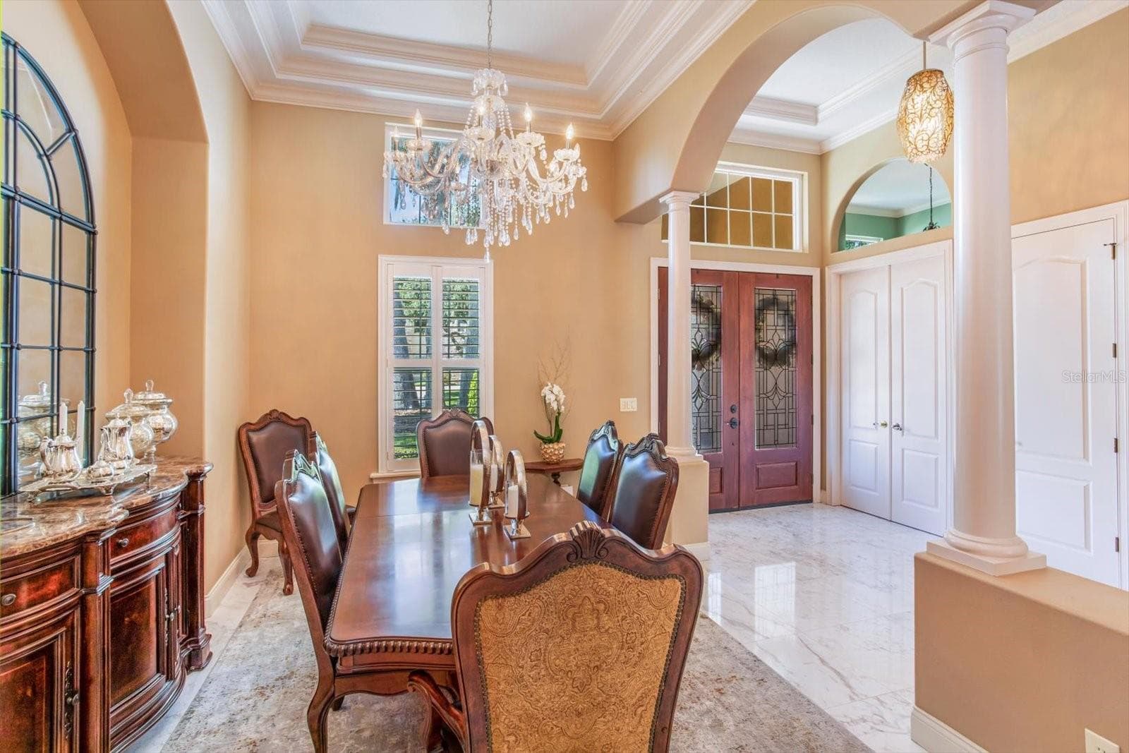 Dining Room with triple tray ceiling, chandalier and inset area for Dining Hutch - 1220 PRESTIGE PT, OVIEDO