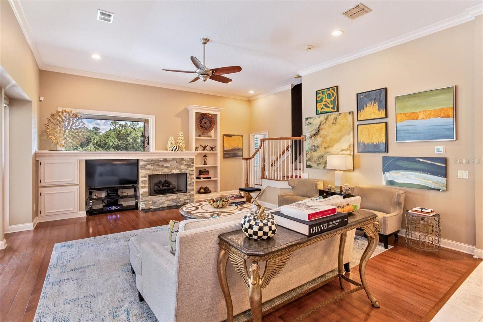 Family Room and gas fireplace with French Doors to Pool & Lanai to left - 1220 PRESTIGE PT, OVIEDO