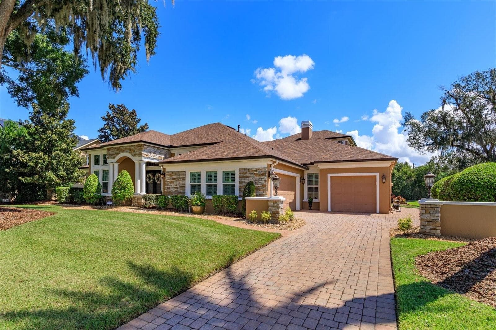 Extended and widened paved driveway, goes back to the back garage service door entrance - 1220 PRESTIGE PT, OVIEDO