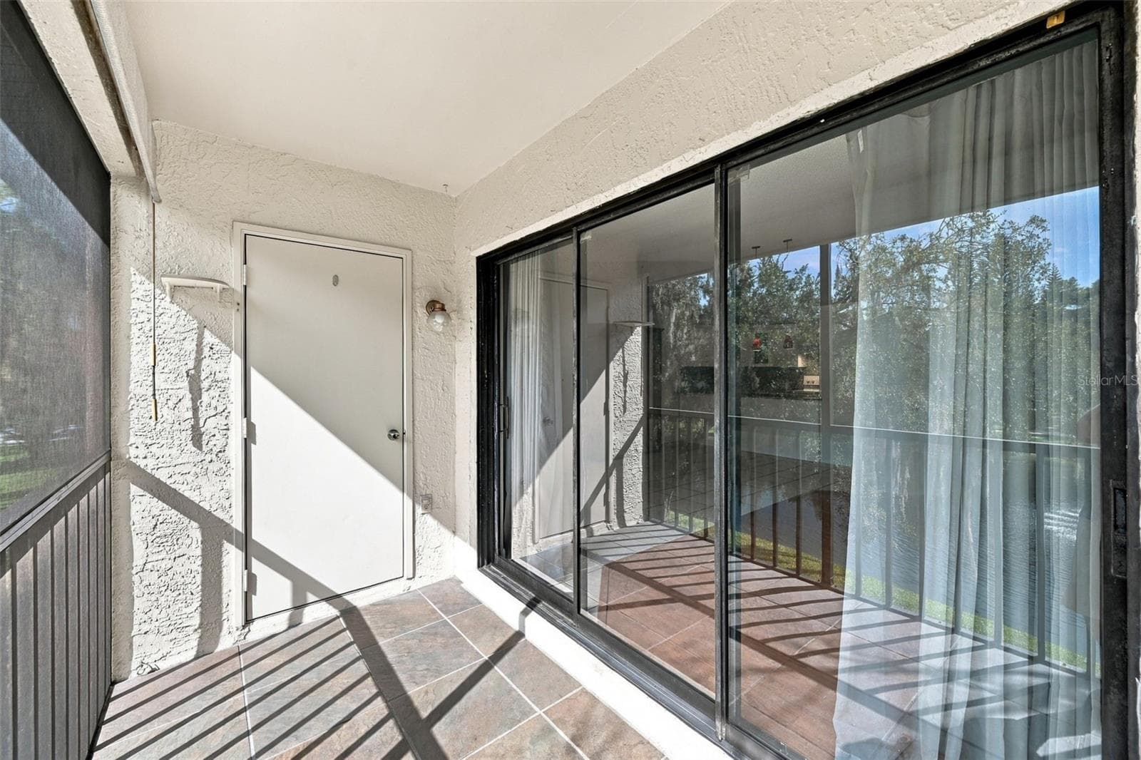 Front porch off Living Room - 3380 CRYSTAL CT E #P, PALM HARBOR
