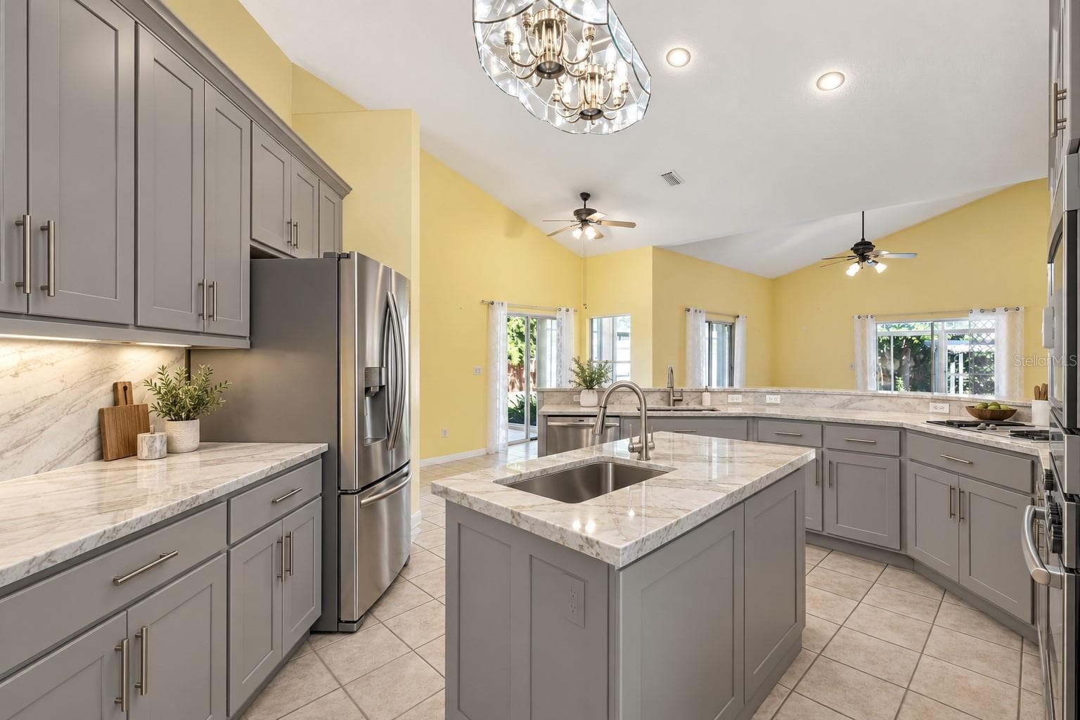 Virtually Changed to show remodel with new counters and painted existing cabinets. - 4325 FARRELL LN, ORLANDO
