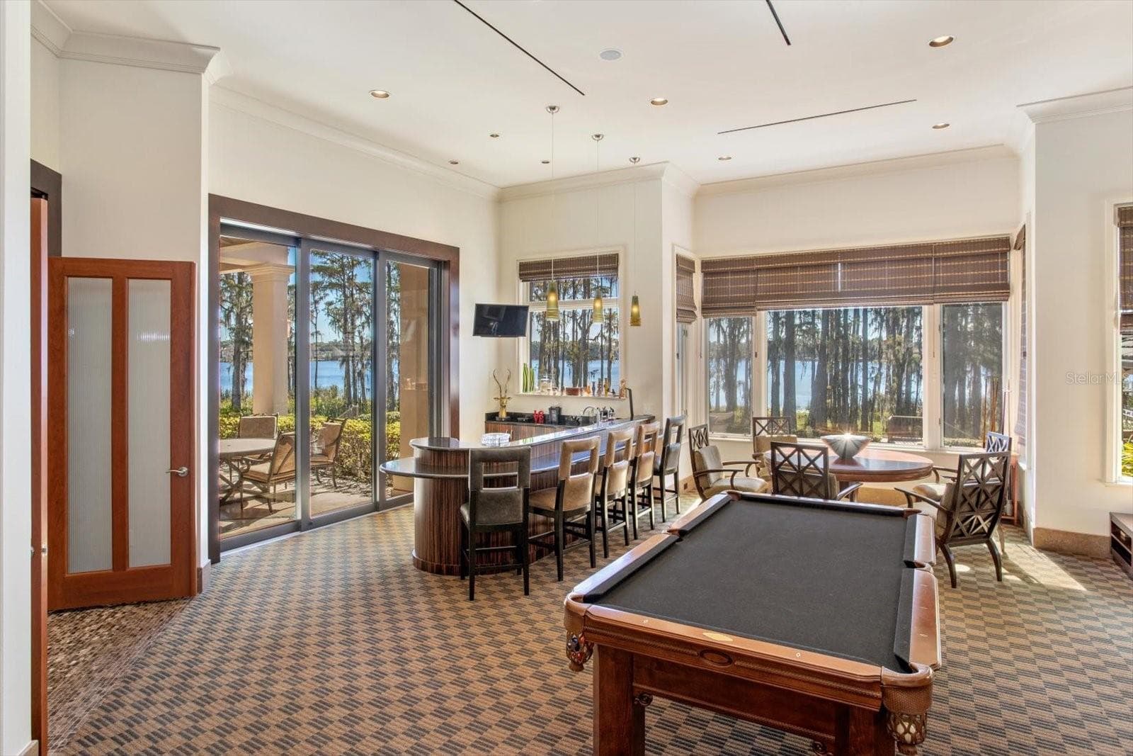 Pocket doors that fade away into the walls throughout - 5192 VARDON DR, WINDERMERE
