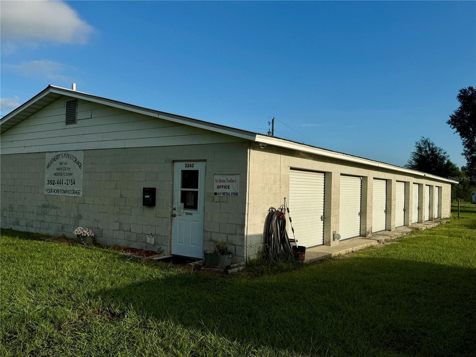 Entryway to office and side view of storage units - 2262 E C-478, WEBSTER