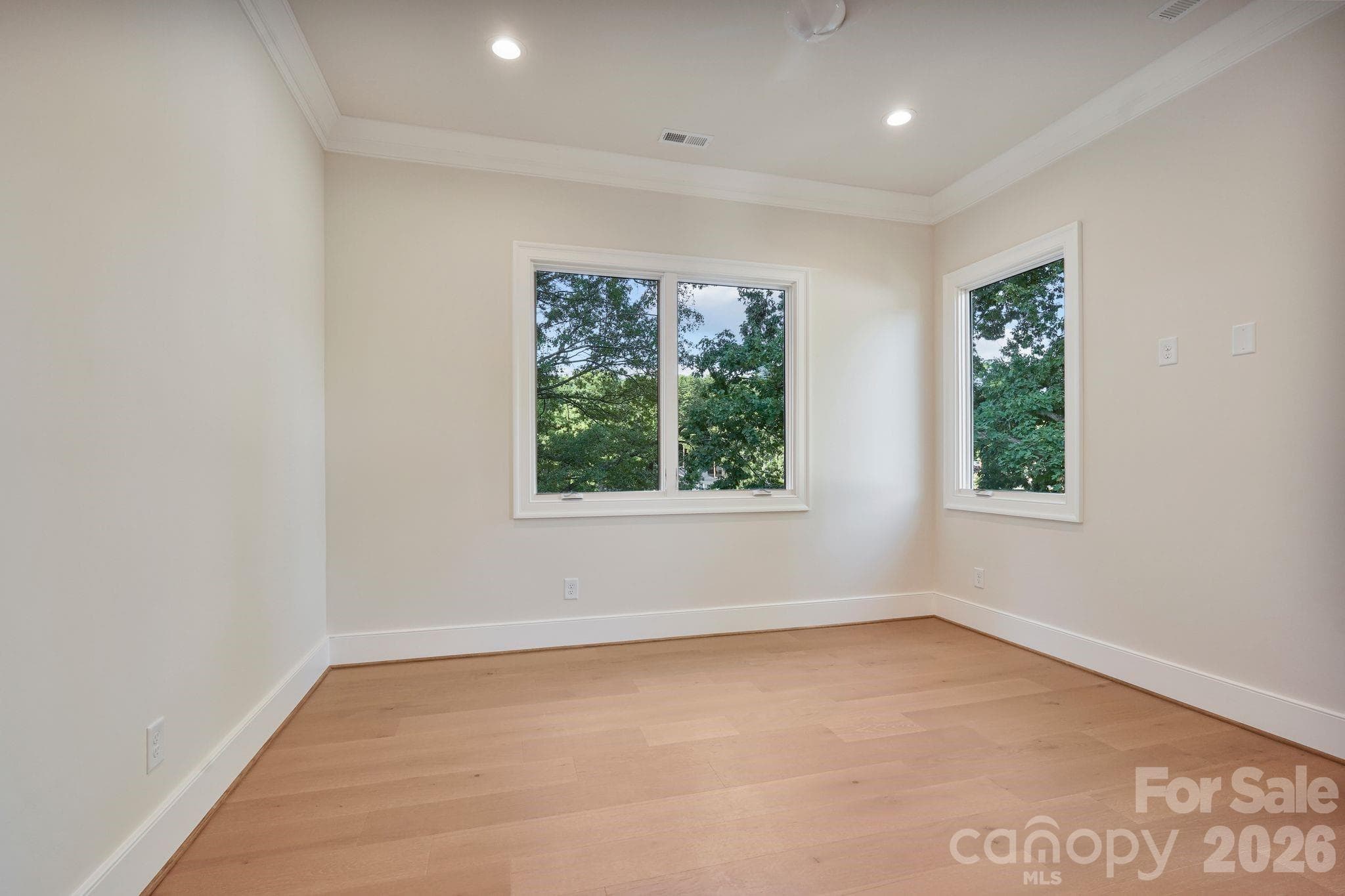 Bedroom 2 features a private full ensuite bath, offering guests or family members added comfort, convenience, and privacy. - 21216 Rio Oro Drive, Cornelius