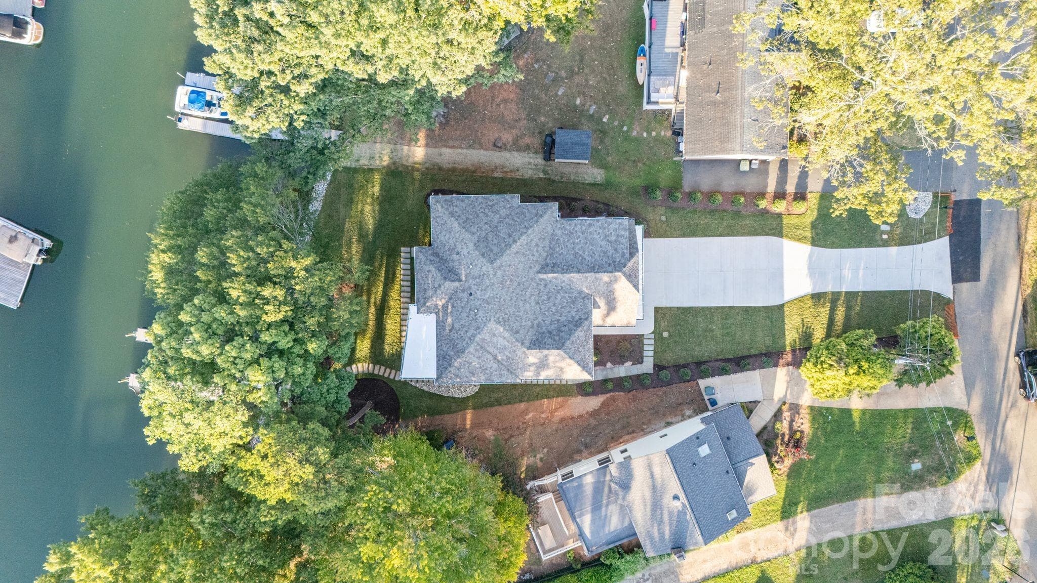 Waterfront on Lake Norman, minutes to the main channel, yet tucked away on a calm cove. - 21216 Rio Oro Drive, Cornelius