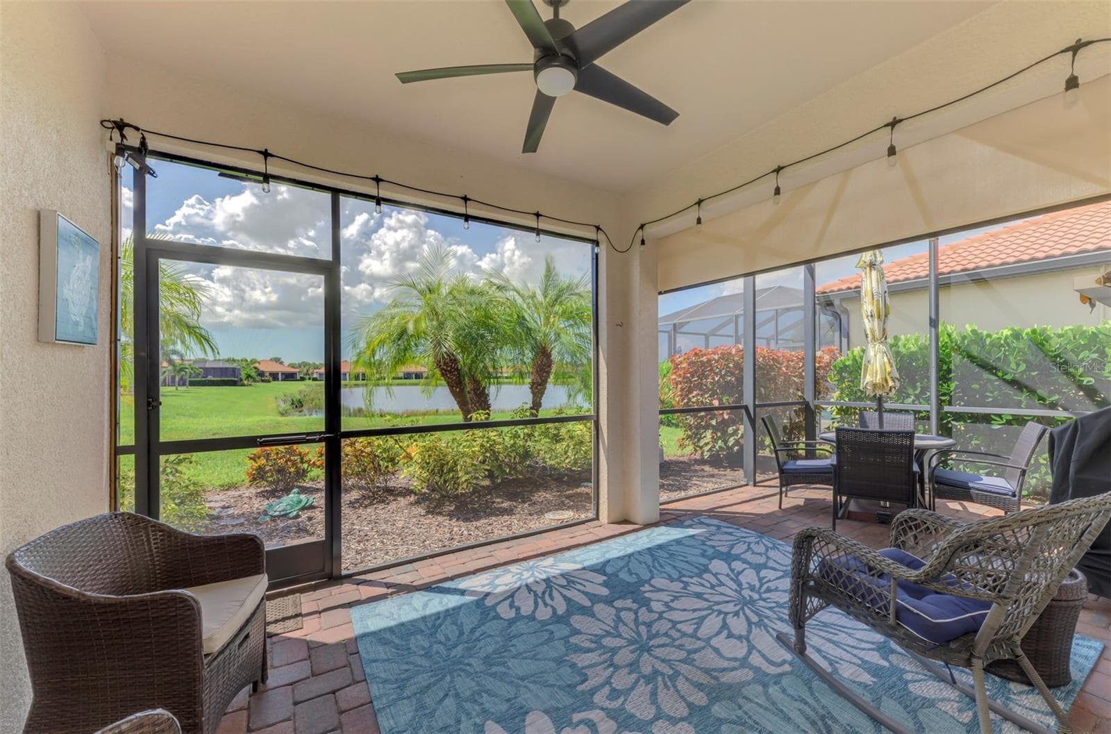 Extended lanai with pond view. - 9845 HILLTOP DR, VENICE
