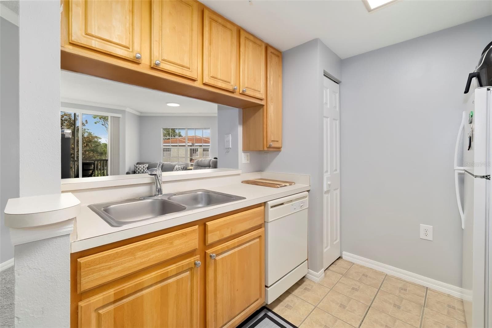 Kitchen with Living Room View. - 5500 BENTGRASS DR #6-203, SARASOTA