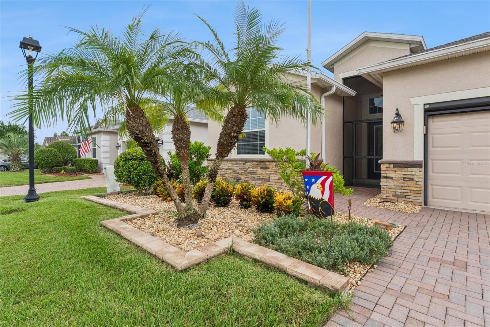Stone Exterior Facade and Screened-in Entry - 3541 RALEIGH DR, WINTER HAVEN