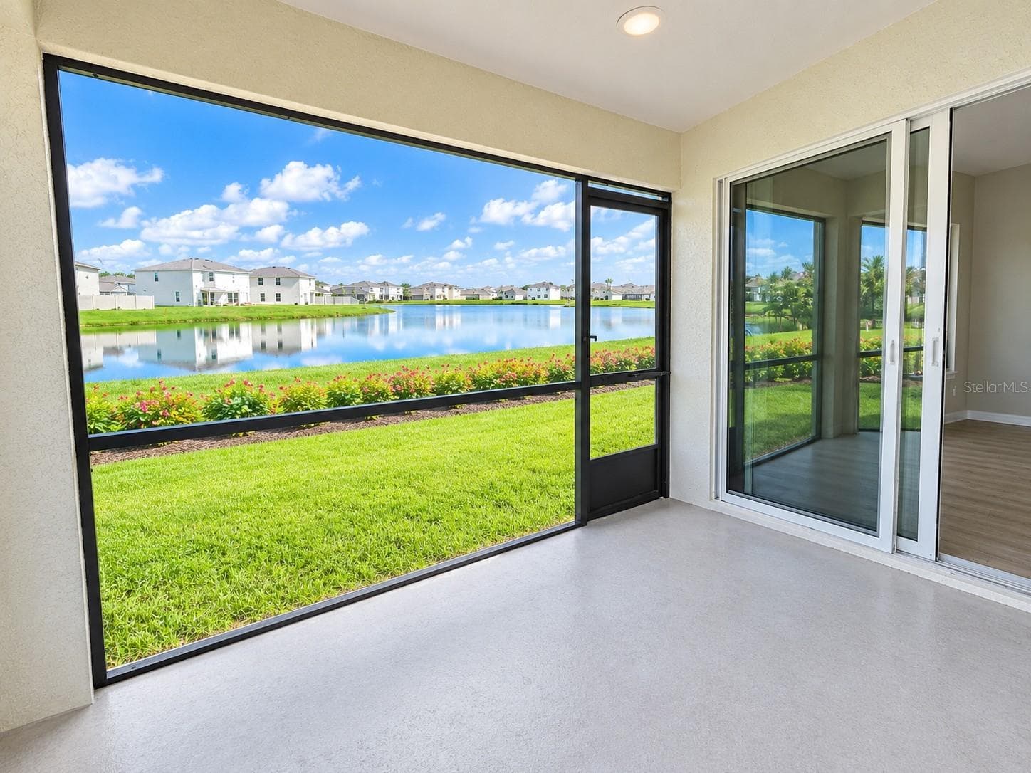 lanai with view of pond - 11904 MOUNTAIN ISLAND TRL, PARRISH