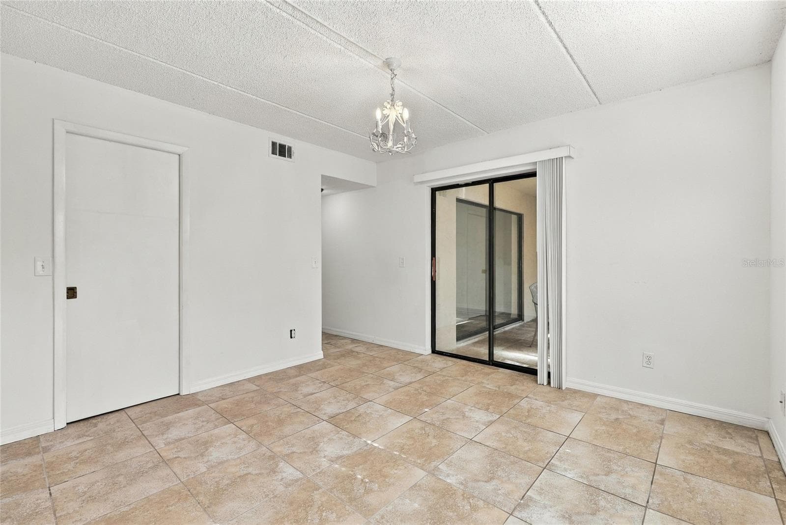 Primary Bedroom with Sliders to Back Patio - 131 WOODLAKE WYNDE, OLDSMAR