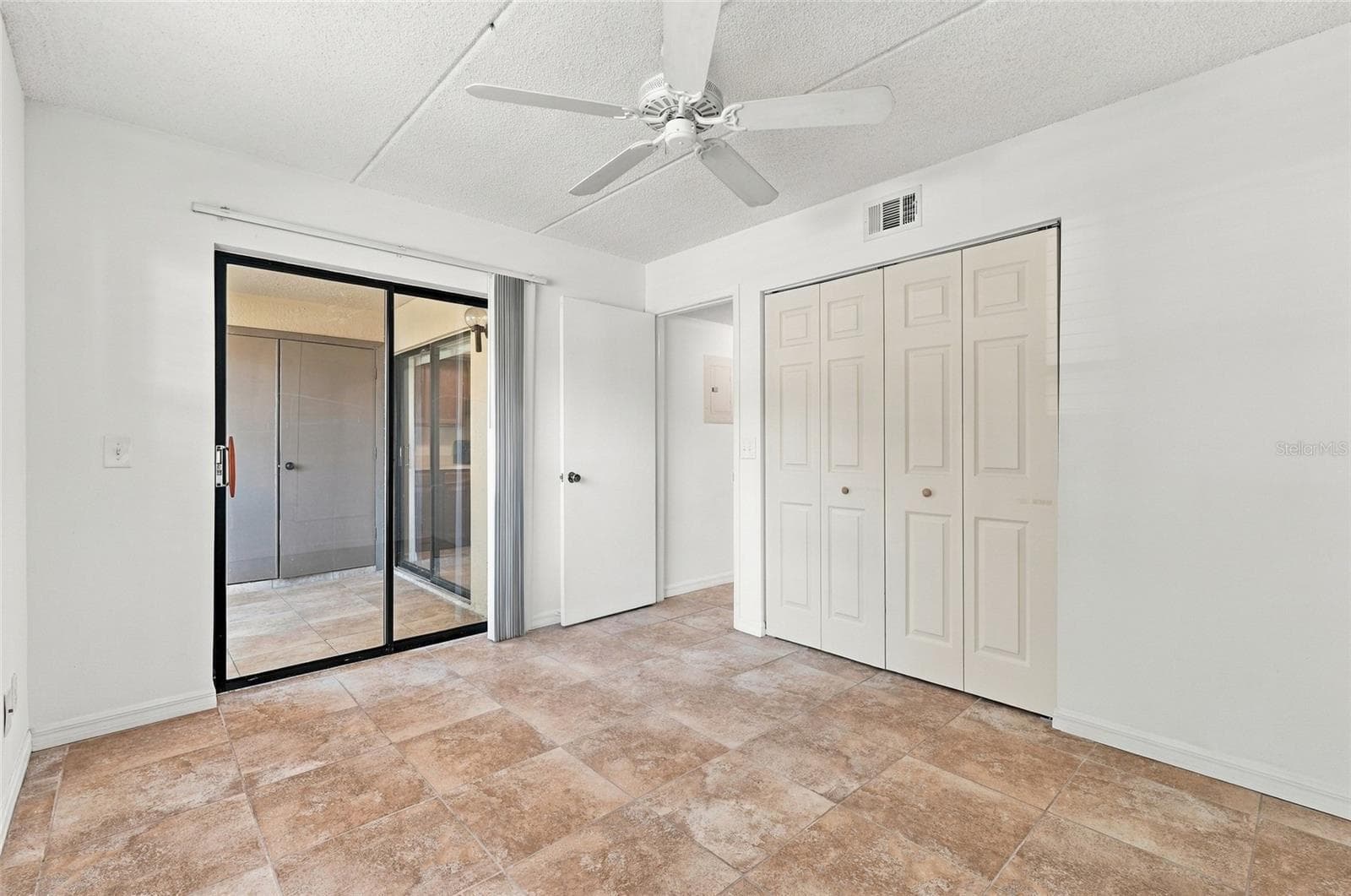 2nd Bedroom with Sliders to Front Patio - 131 WOODLAKE WYNDE, OLDSMAR
