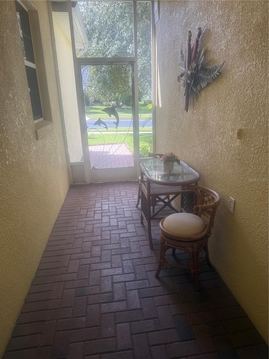 Front screened foyer - 803 WOLF CREEK ST, CLERMONT