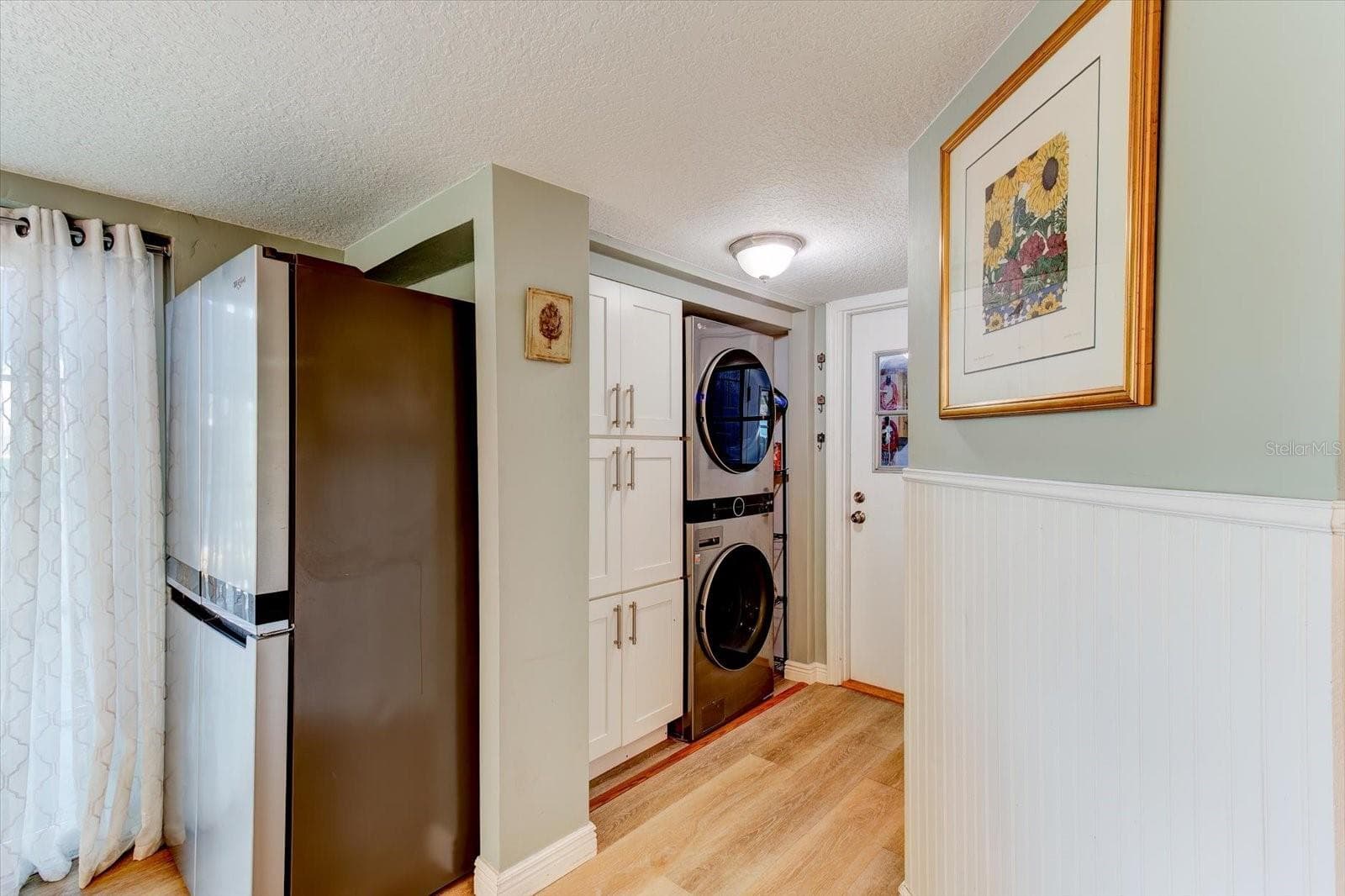 Indoor laundry with additional kitchen storage - 116 PARTRIDGE CIR, WINTER SPRINGS
