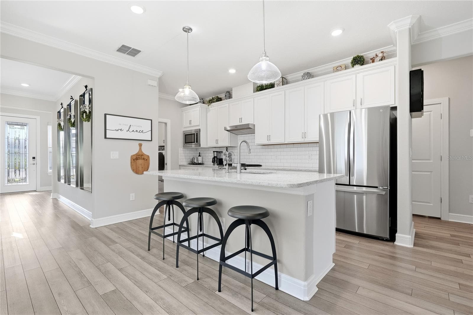 Stainless Steel appliances and subway tile. - 5535 BLUE CRUSH BND, LAND O LAKES