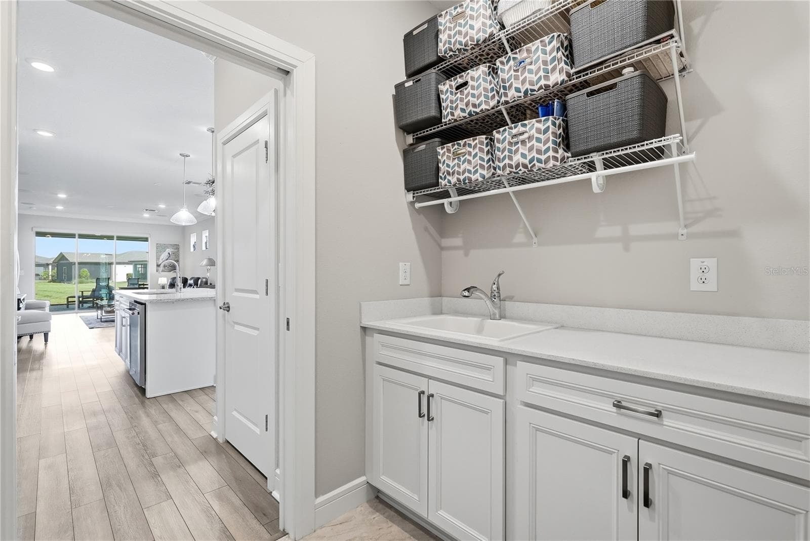 Dedicated Laundry Room with upgraded cabinets PLUS utility sink. - 5535 BLUE CRUSH BND, LAND O LAKES