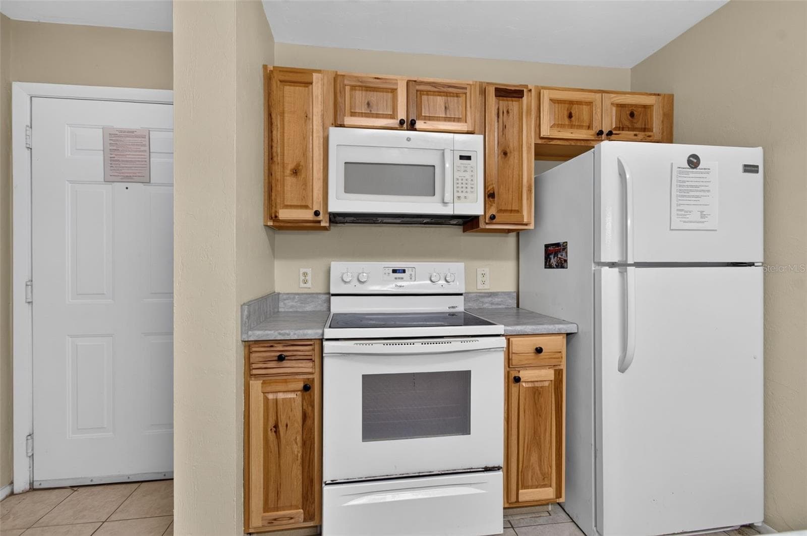 Kitchen and front door - 4000 SW 23RD ST #2-105, GAINESVILLE