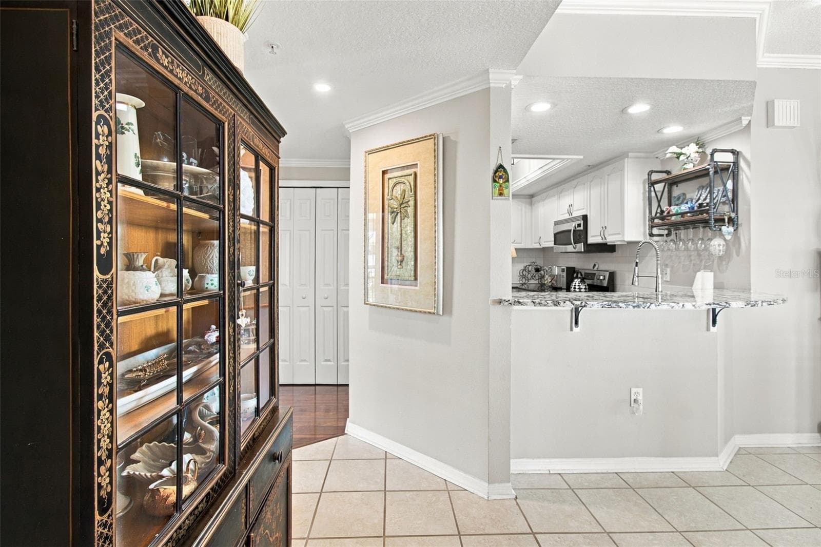 Entry area to dining room - 399 150TH AVE #205, MADEIRA BEACH
