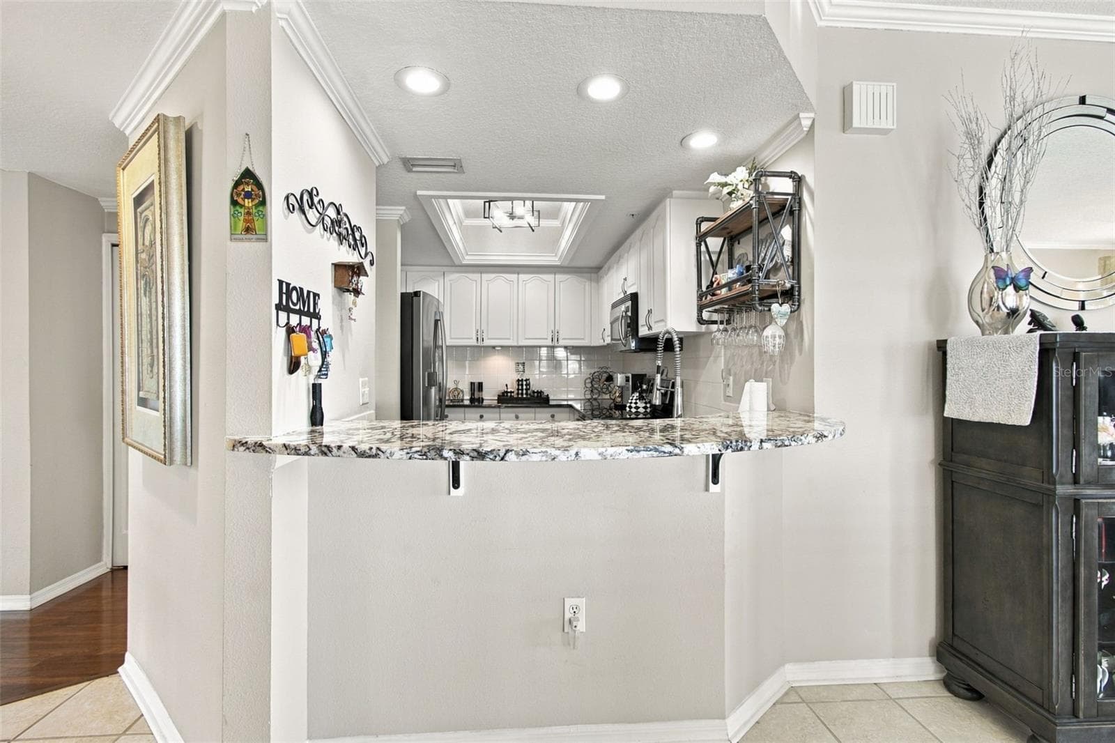Looking into kitchen from dining room - 399 150TH AVE #205, MADEIRA BEACH