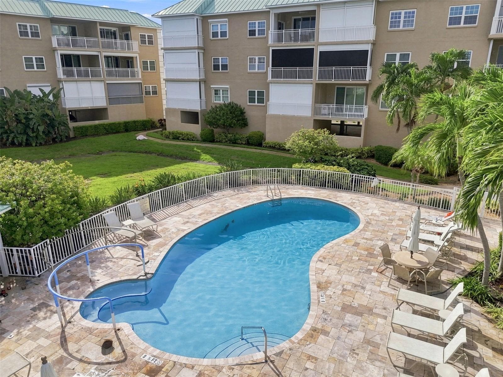 Swimmin pool adjacent to clubhouse - 399 150TH AVE #205, MADEIRA BEACH