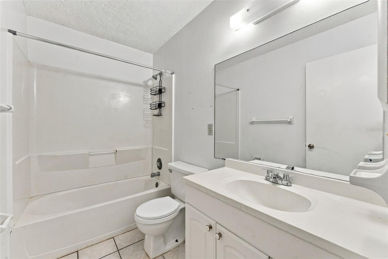 Hallway Bathroom with Modern Vanity - 7303 RIVERBANK DR, NEW PORT RICHEY