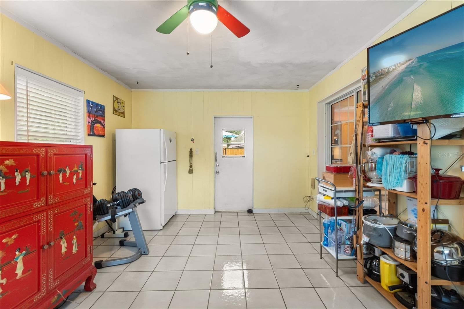 Bonus room with door to backyard straight ahead and sliding glass door to the right leads to the dining room. - 4511 LONGWORTH DR, ORLANDO