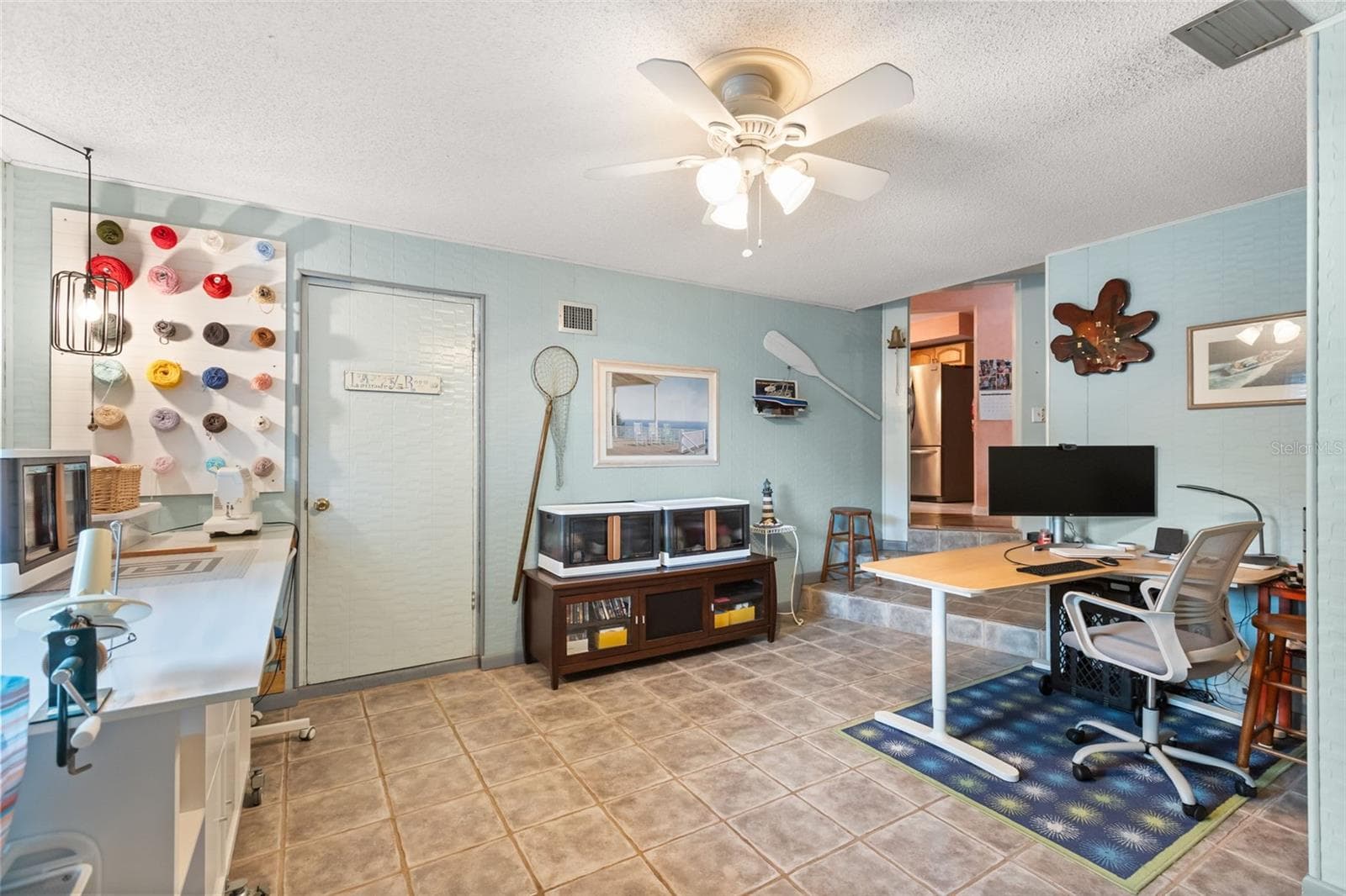 One of the downstairs bonus rooms with door to laundry/utility room. - 4511 LONGWORTH DR, ORLANDO