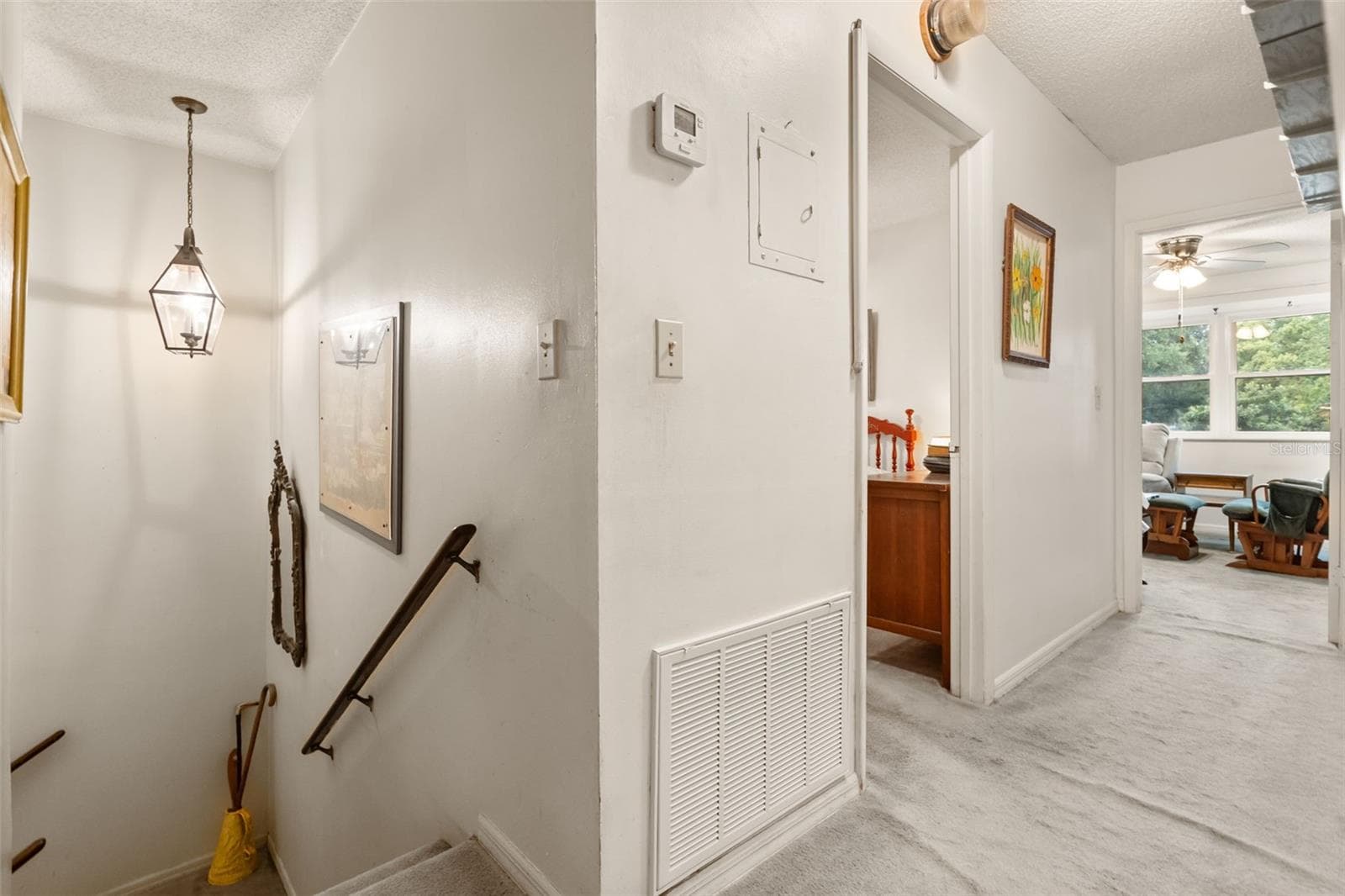 Upstairs has two bedrooms, a living area, butler pantry, and a bathroom. - 4511 LONGWORTH DR, ORLANDO