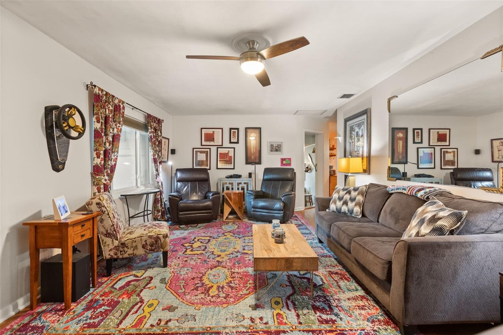 The front door is to the left, hallway to bedrooms behind photographer. Doors at far right lead to a bonus room (left) and dining room and kitchen (right). - 4511 LONGWORTH DR, ORLANDO