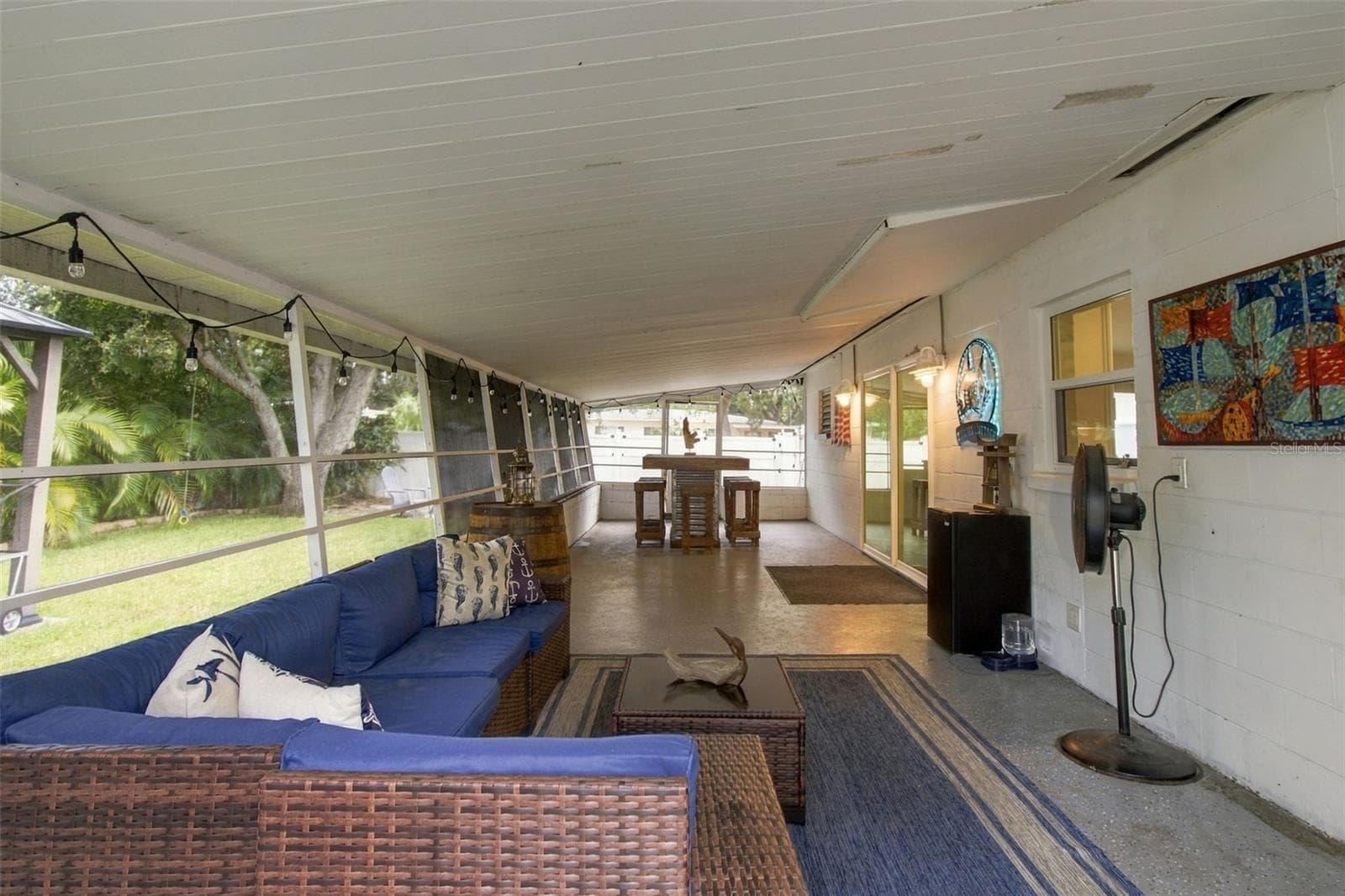 The back porch spans almost the width of the home! - 4501 TRASK ST, TAMPA
