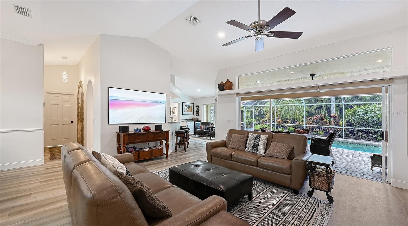 Living room with sliders open - 5220 SUNNYDALE CIR S, SARASOTA