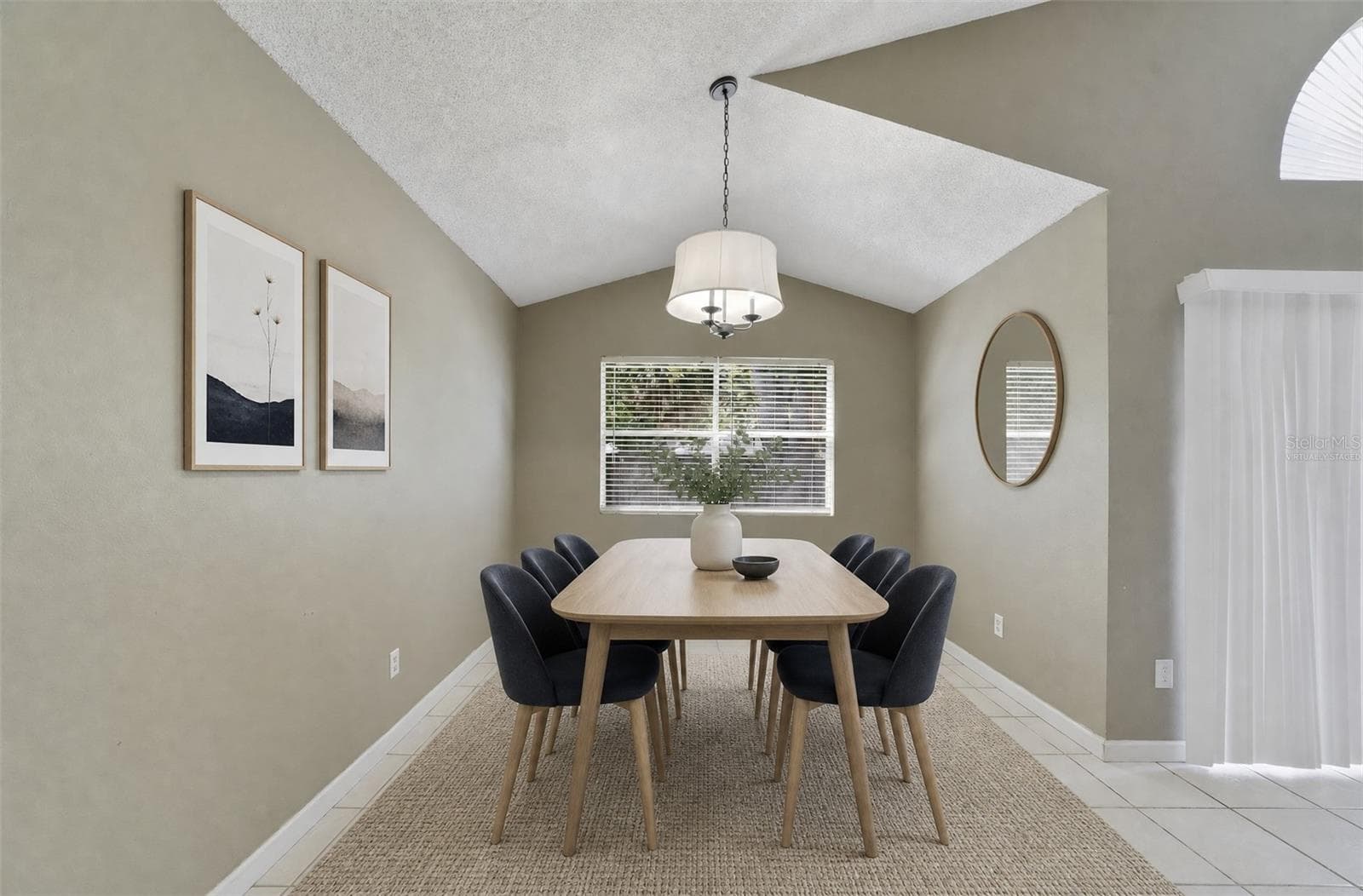 Nearby, the Dining Room enjoys a pleasant VIEW OF THE BACKYARD, and provides a comfortable setting for meals and gatherings. Virtually Staged - 713 MEADOWSIDE CT, ORLANDO