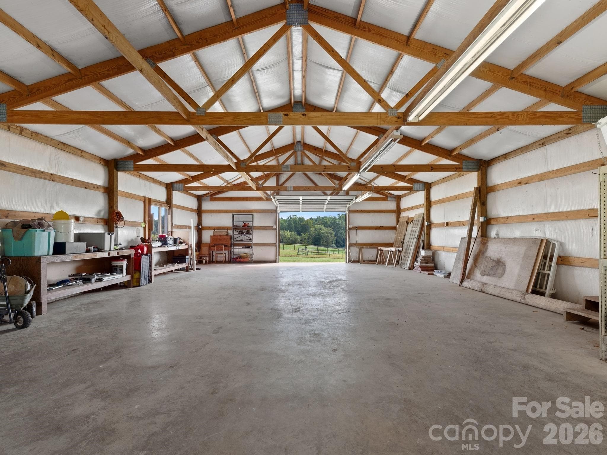 Huge garage workshop building has doors at both ends for easy drive thru, as well as electricity. - 157 J A Hampton Road, Rutherfordton