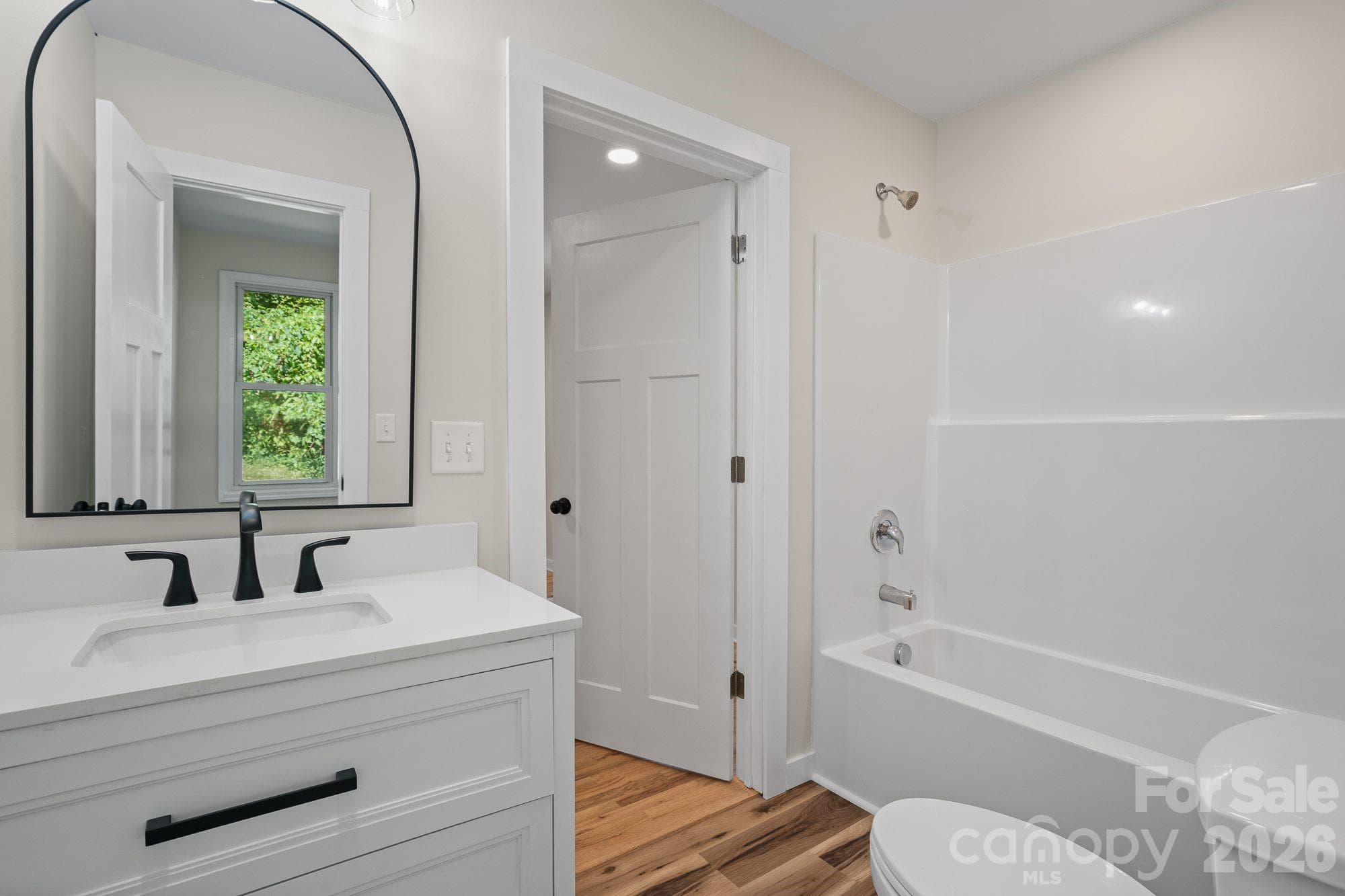 Second En-Suite: Renovated en-suite bathroom with stylish updates. - 156 State Street, Asheville