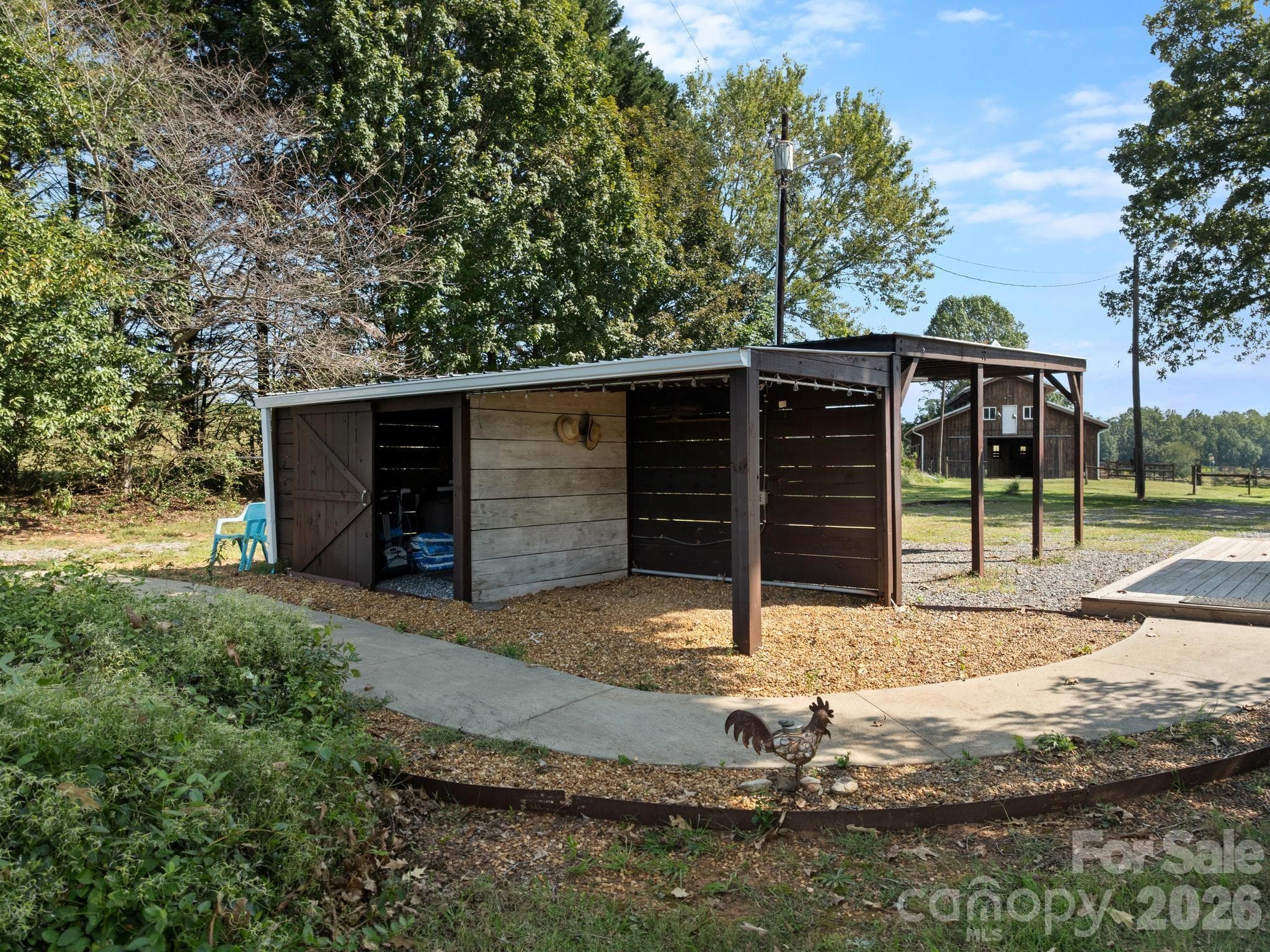 Backside of the carport is a cabana for storing equipment for the pool - 157 J A Hampton Road, Rutherfordton