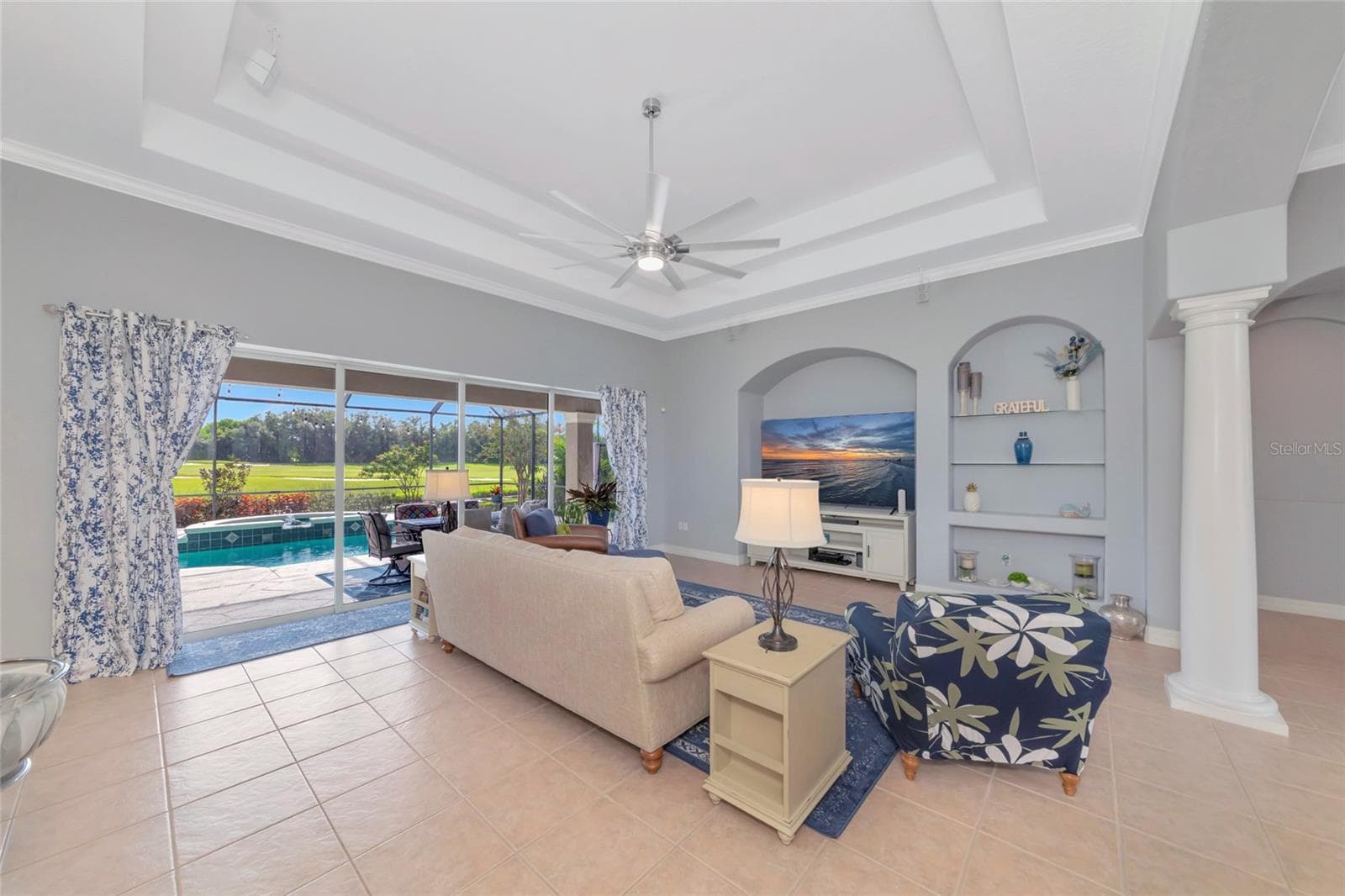 Large great room with double tray ceilings tile floors - 817 MARITIME CT, BRADENTON