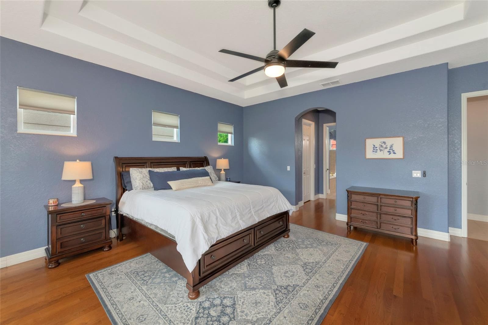 Primary bedroom first floor, wood floors. - 817 MARITIME CT, BRADENTON