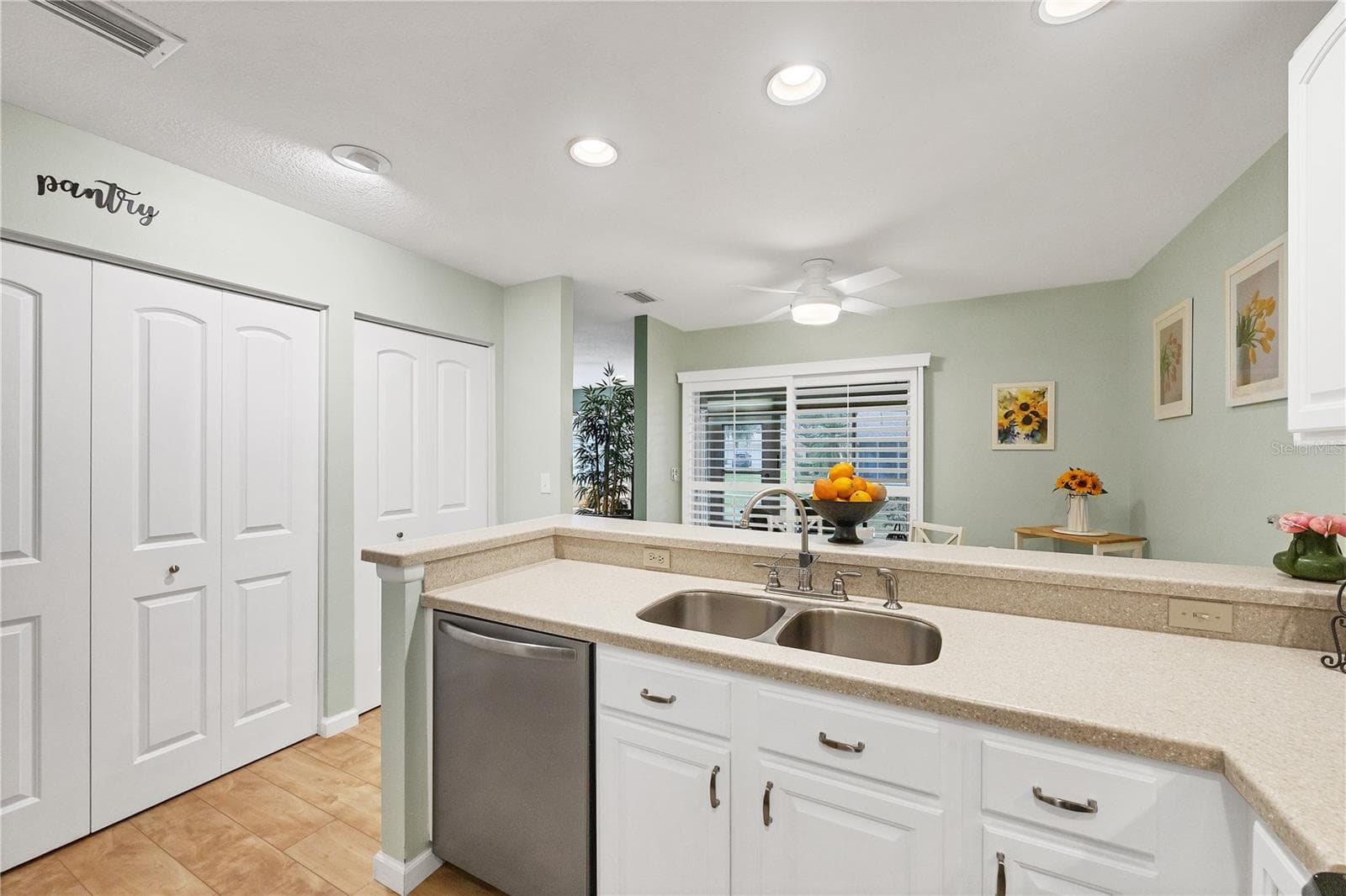 Kitchen with pantry doors on the left - 4021 OAKHURST DR #3121, SARASOTA