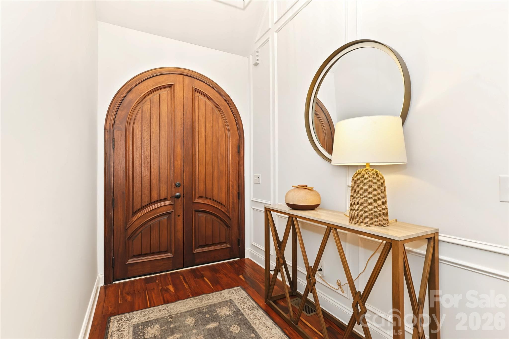 Beautiful arched front door and the welcoming foyer - 4934 Spalding Place, Charlotte