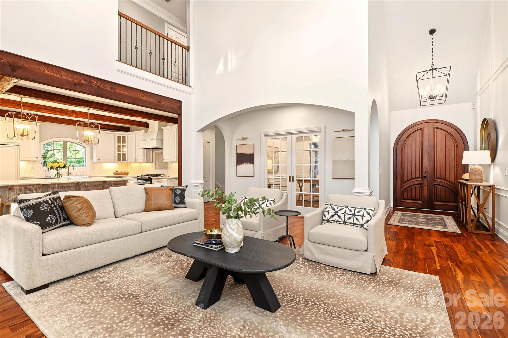 Spacious living Room with soaring ceiling that opens up to the kitchen, office area and front foyer. - 4934 Spalding Place, Charlotte
