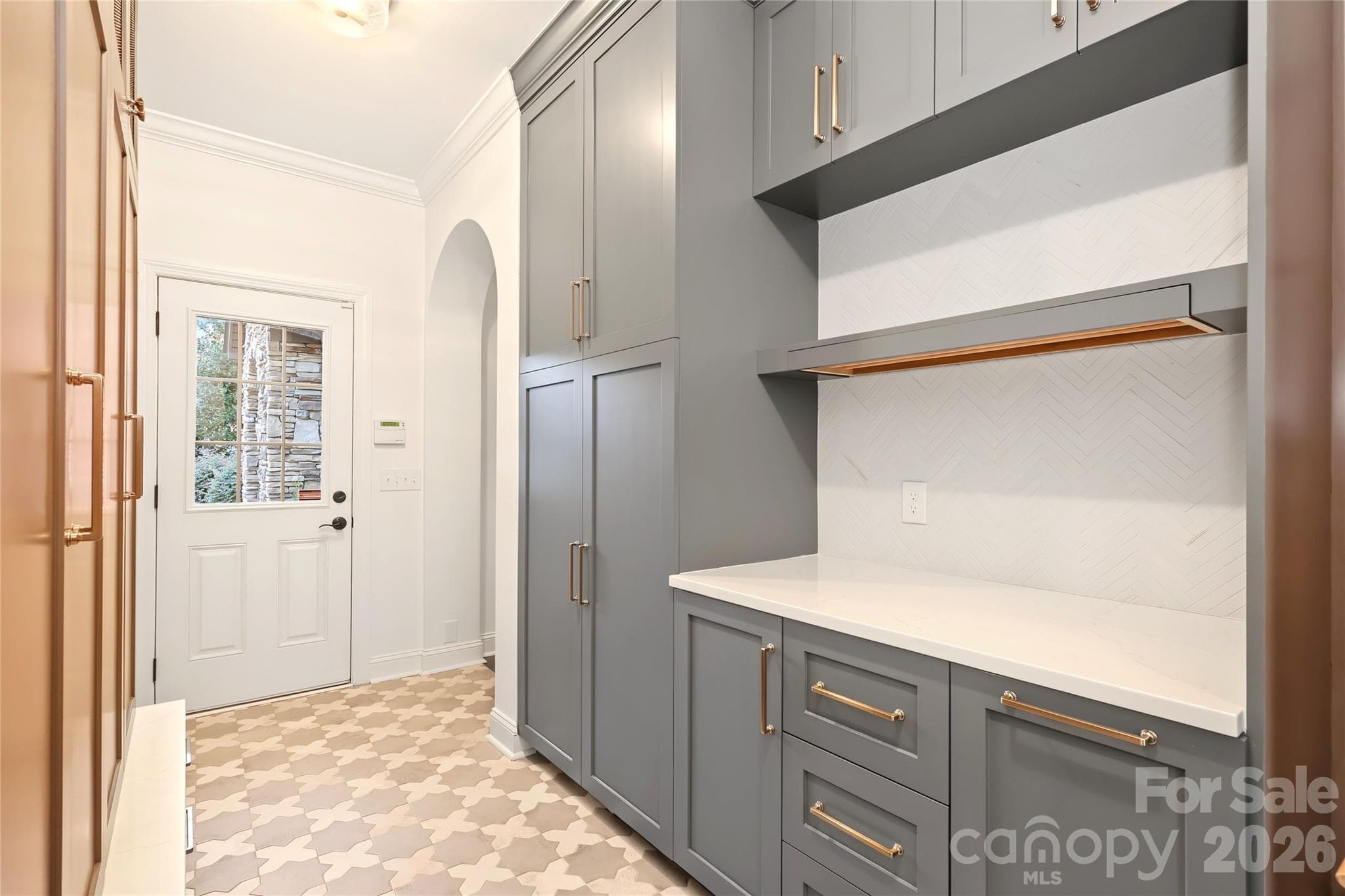 Another view of the Laundry Room with a door leading out to the front driveway. Washer and Dryer are included and are to the right. - 4934 Spalding Place, Charlotte