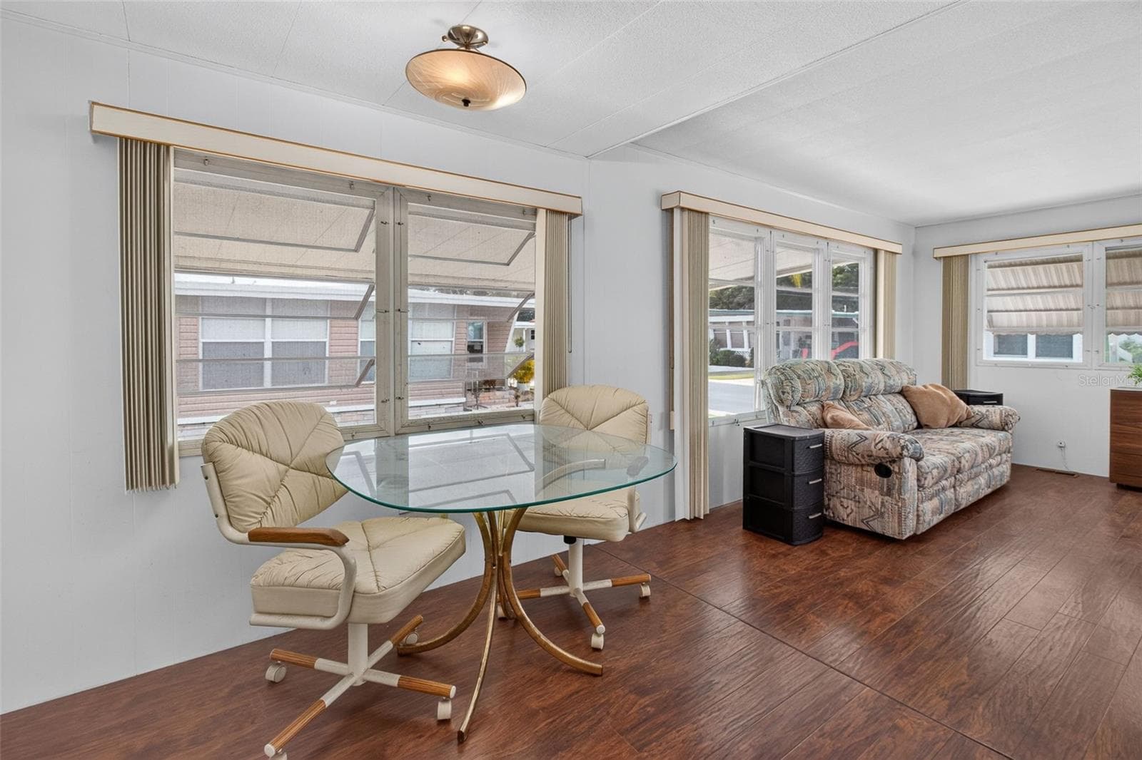 Original table and couches stay, kitchen chairs do not - 2000 E BAY DR #65, LARGO