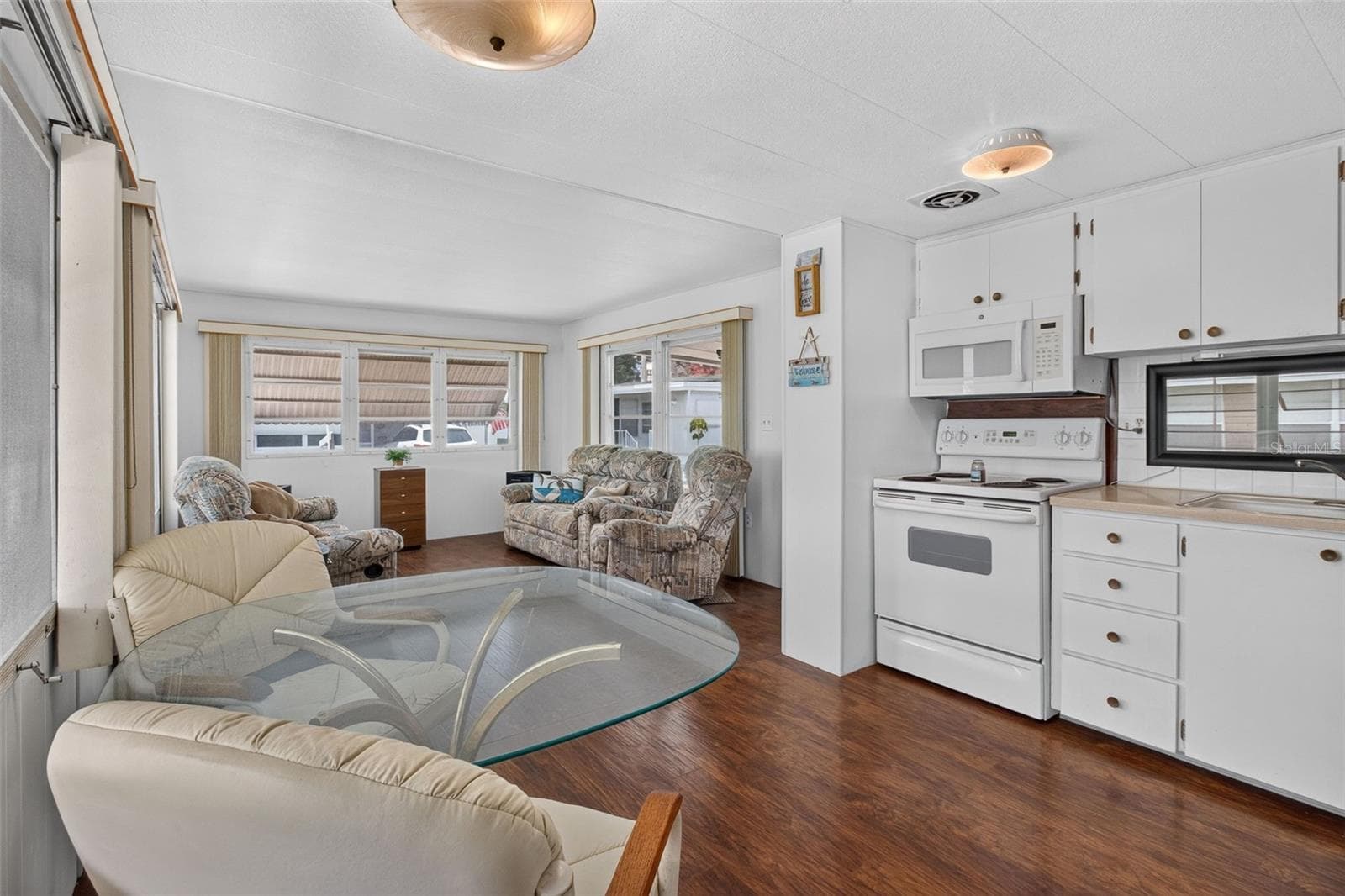 Original table and couches stay, kitchen chairs do not - 2000 E BAY DR #65, LARGO