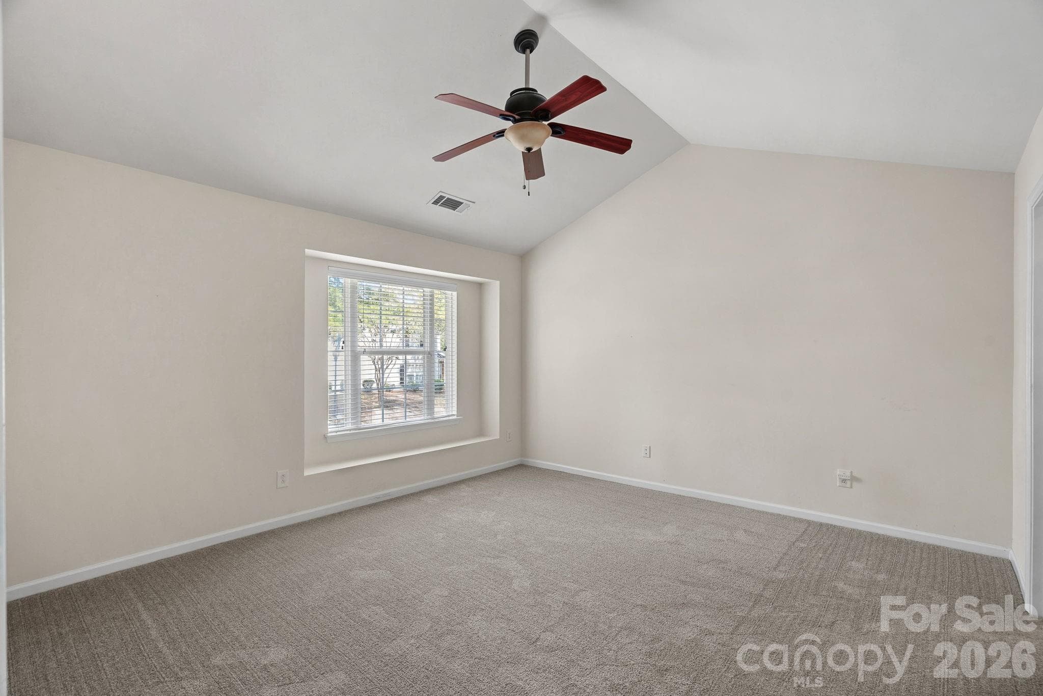 Primary bedroom with vaulted ceilings - 4717 Grier Farm Lane, Charlotte