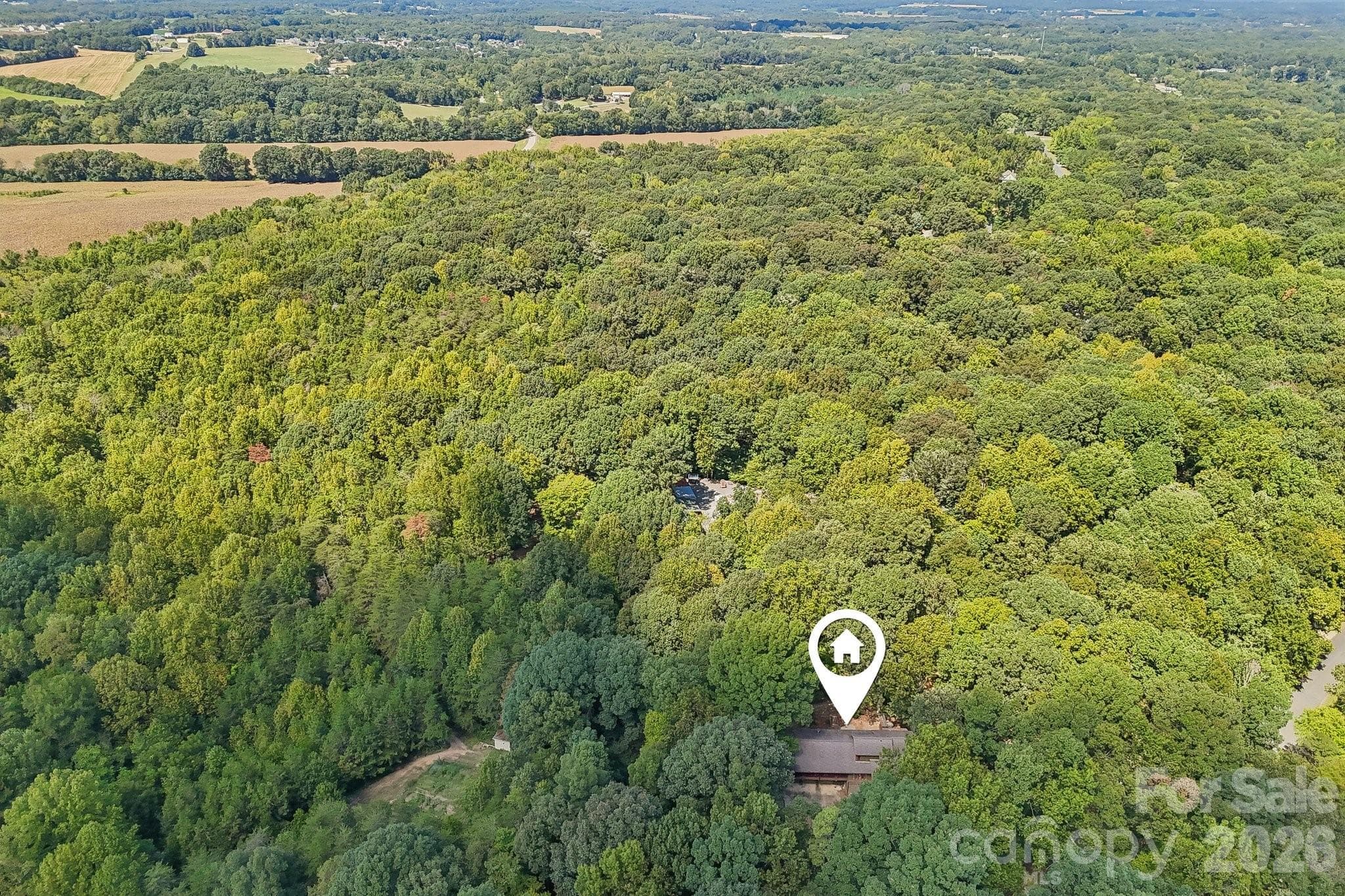10.5 Acres with chicken coop/barn, already fenced-in, garden, quail shed, secondary 3-story building, ATV trails, plenty of space for your homesteading needs! - 2701 Cedar Trail Lane, Wingate