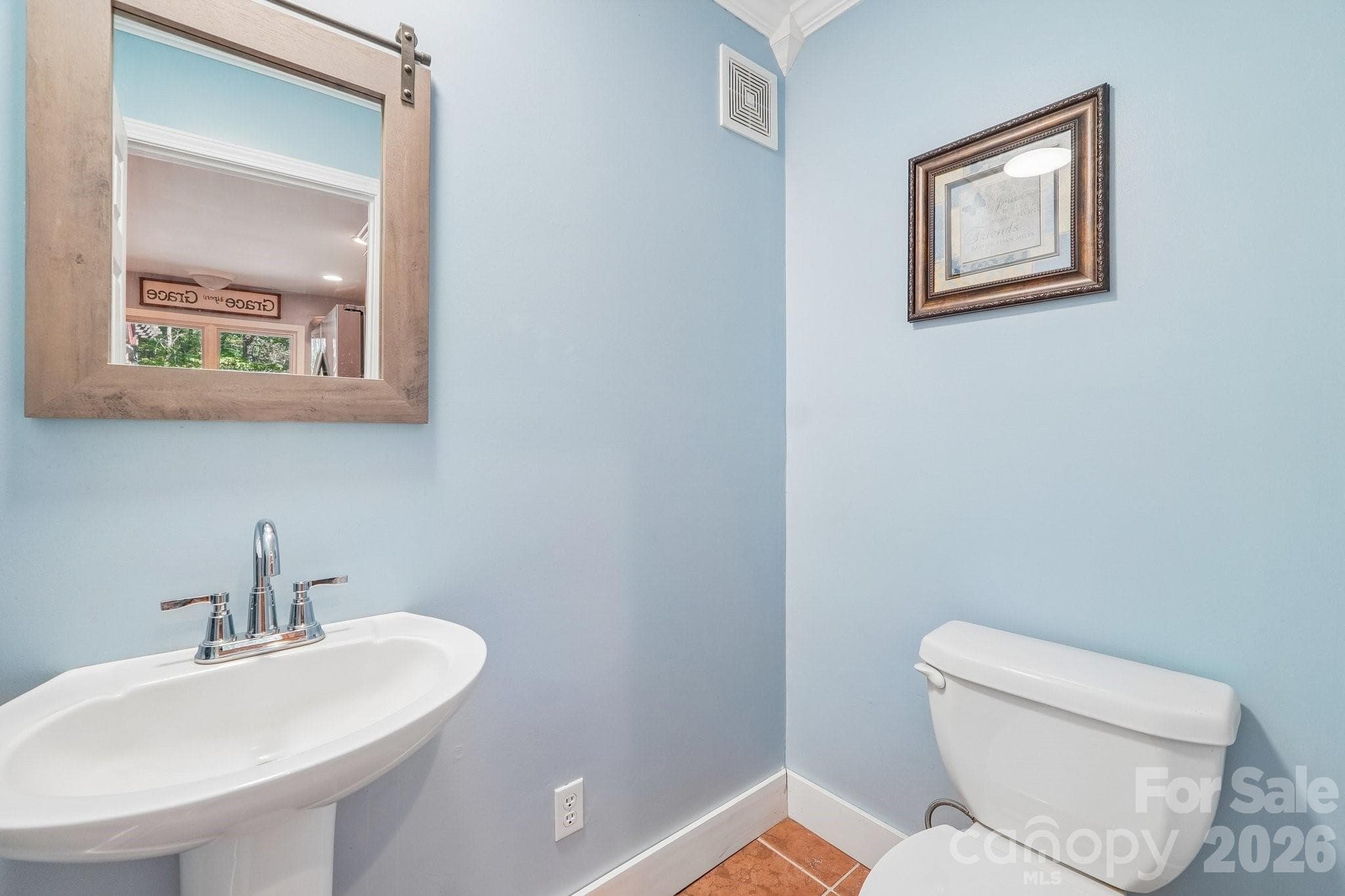Half bath located near the kitchen - 2701 Cedar Trail Lane, Wingate