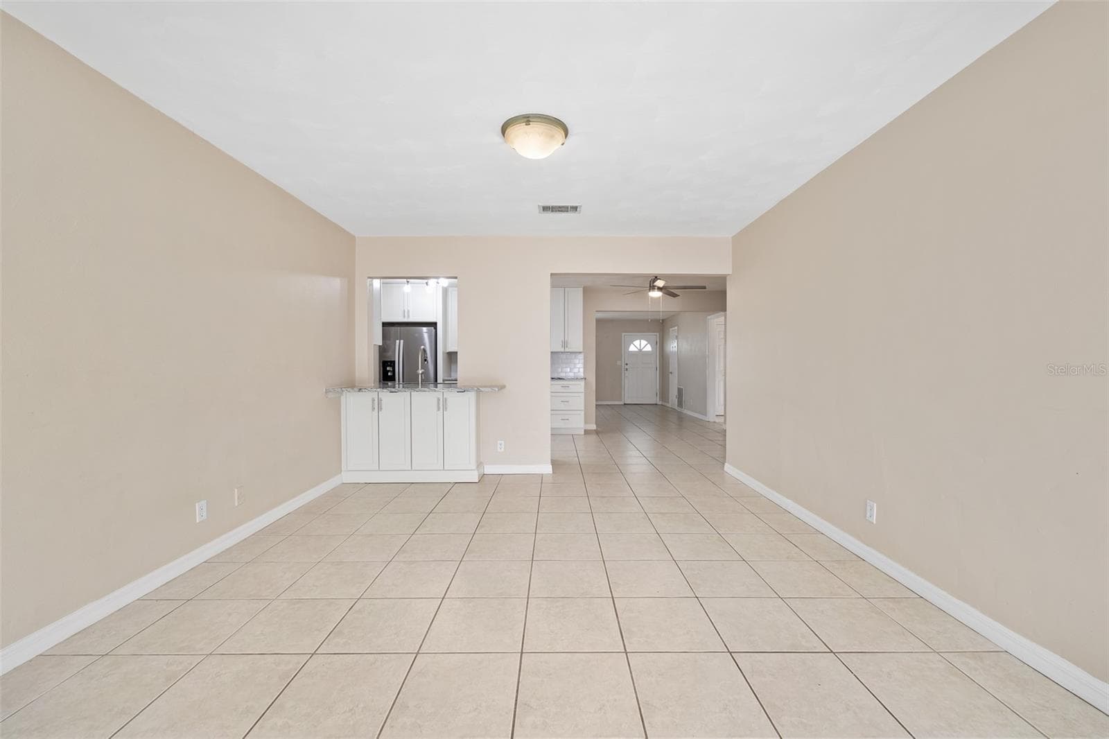 Family Room looking into kitchen - 22 PLAZA DR, ORMOND BEACH