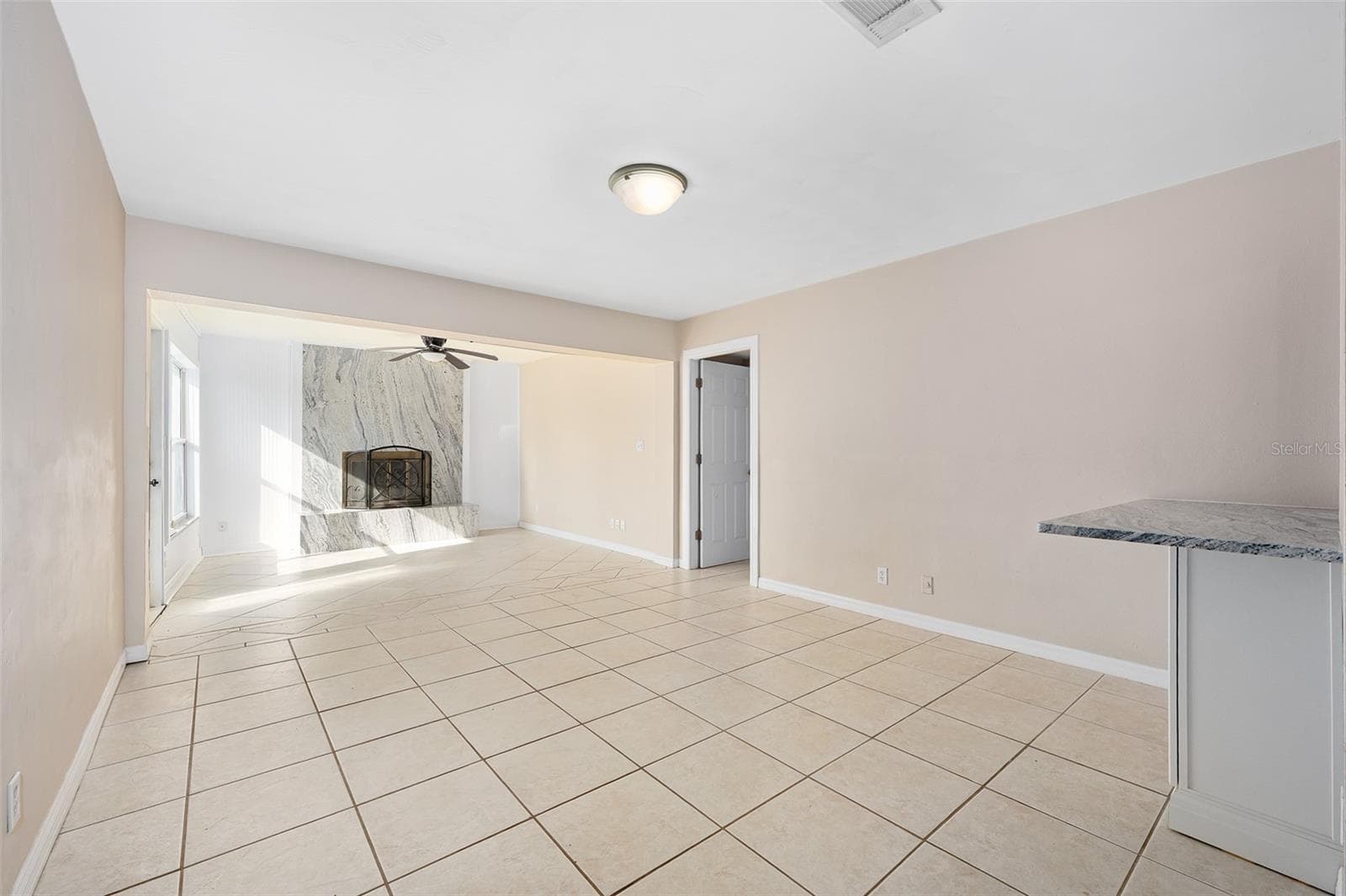 Family Room looking into kitchen - 22 PLAZA DR, ORMOND BEACH