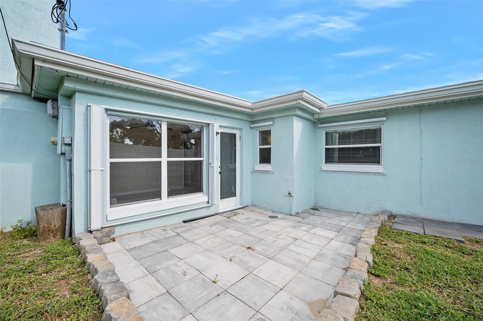 Rear Patio and spacious back yard - 22 PLAZA DR, ORMOND BEACH
