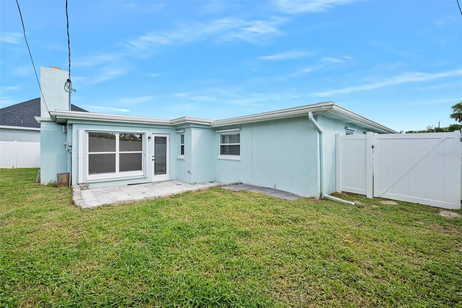 Rear Patio and spacious back yard - 22 PLAZA DR, ORMOND BEACH