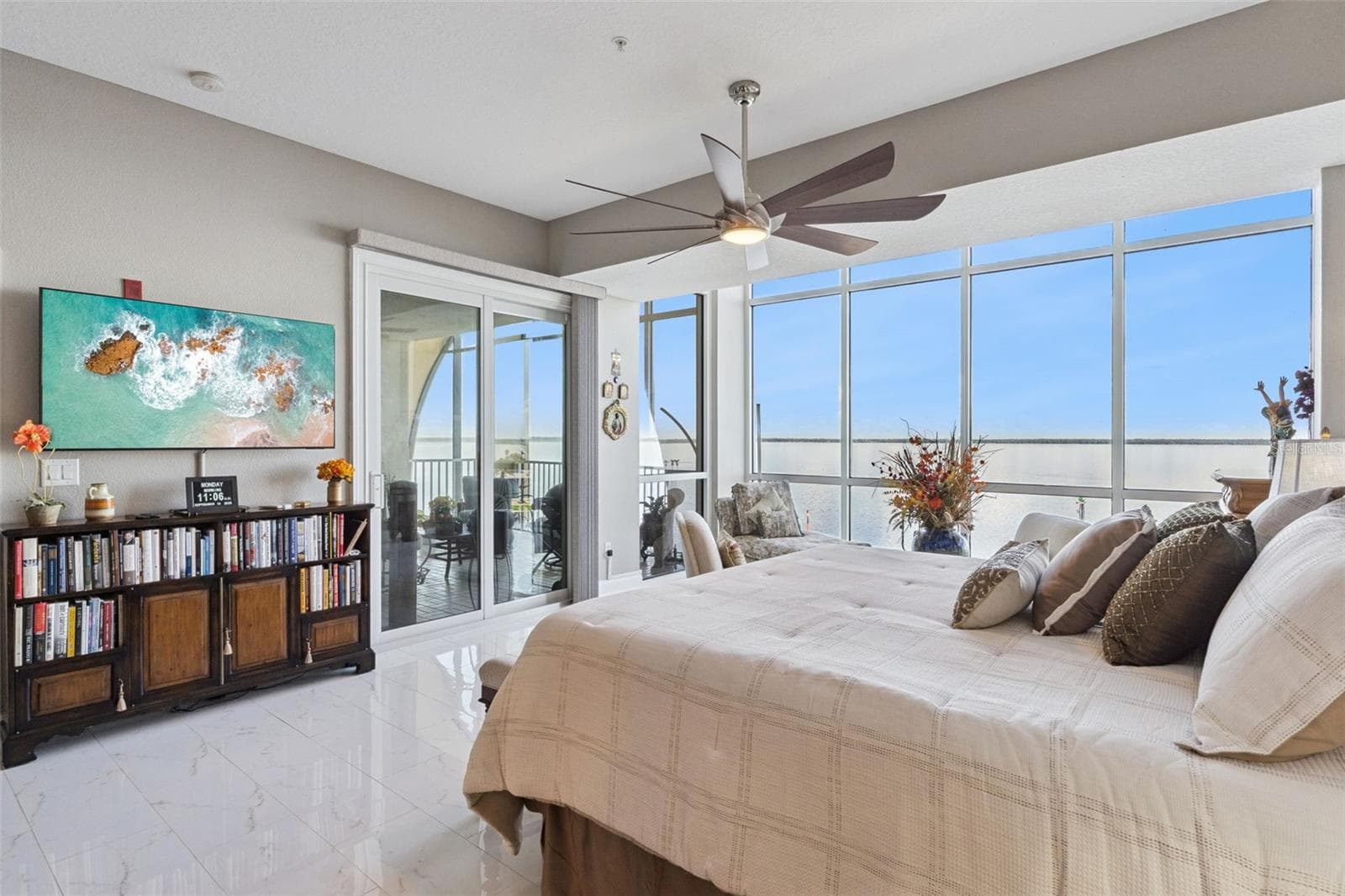 Primary bedroom with balcony access and remote shades. - 225 W SEMINOLE BLVD #603, SANFORD